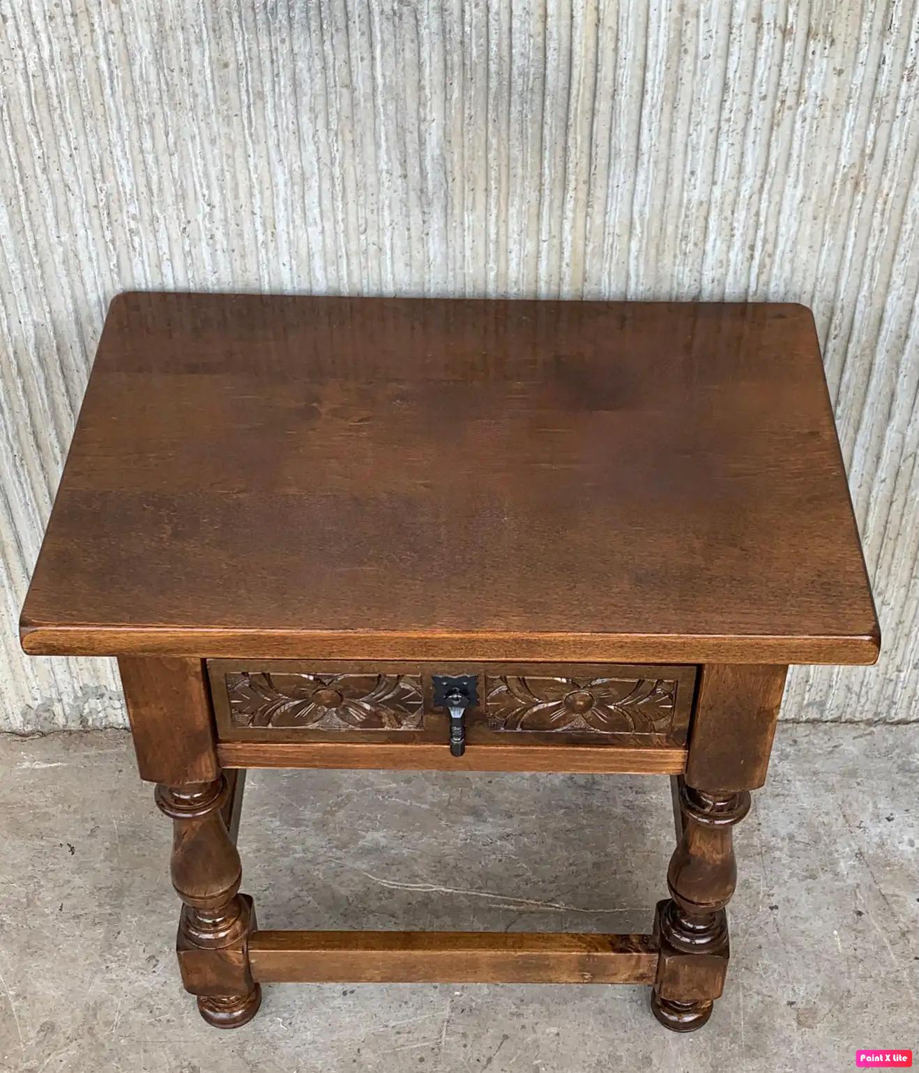 20th century Spanish nightstands in solid walnut with carved drawer and iron hardware.
Beautiful tables that you can use like a nightstands or side tables, end tables, or table lamp.