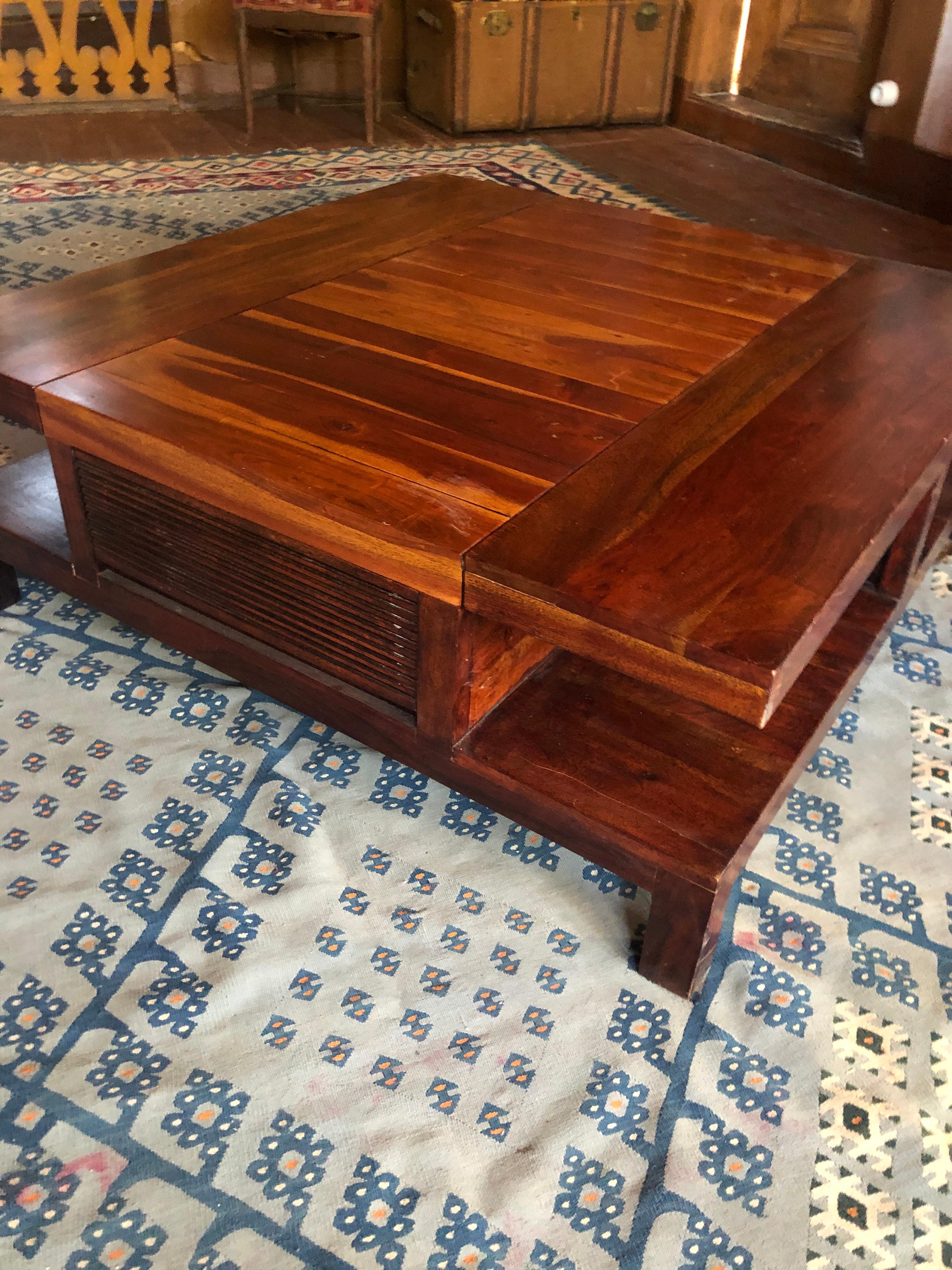 20th Century square table made of massive exotic wood with two side drawers.
France, circa 1960
 