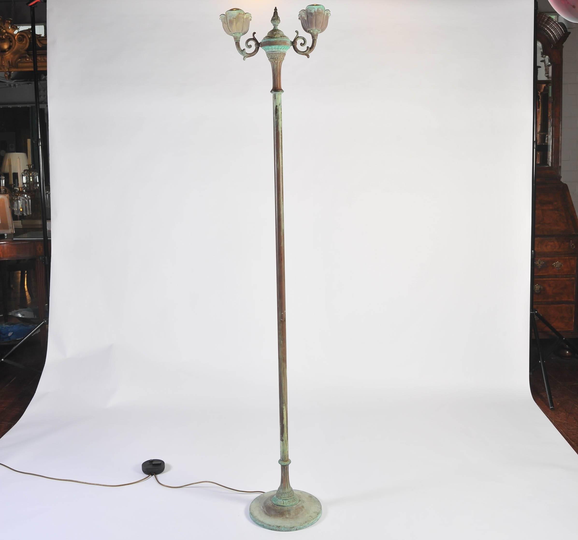 This 20th century standing lamp with a Verdi Gris paint effect with two-light branches supported by a plain column with classical style base and top.
Re-wired with led bulbs and dimmer switch.