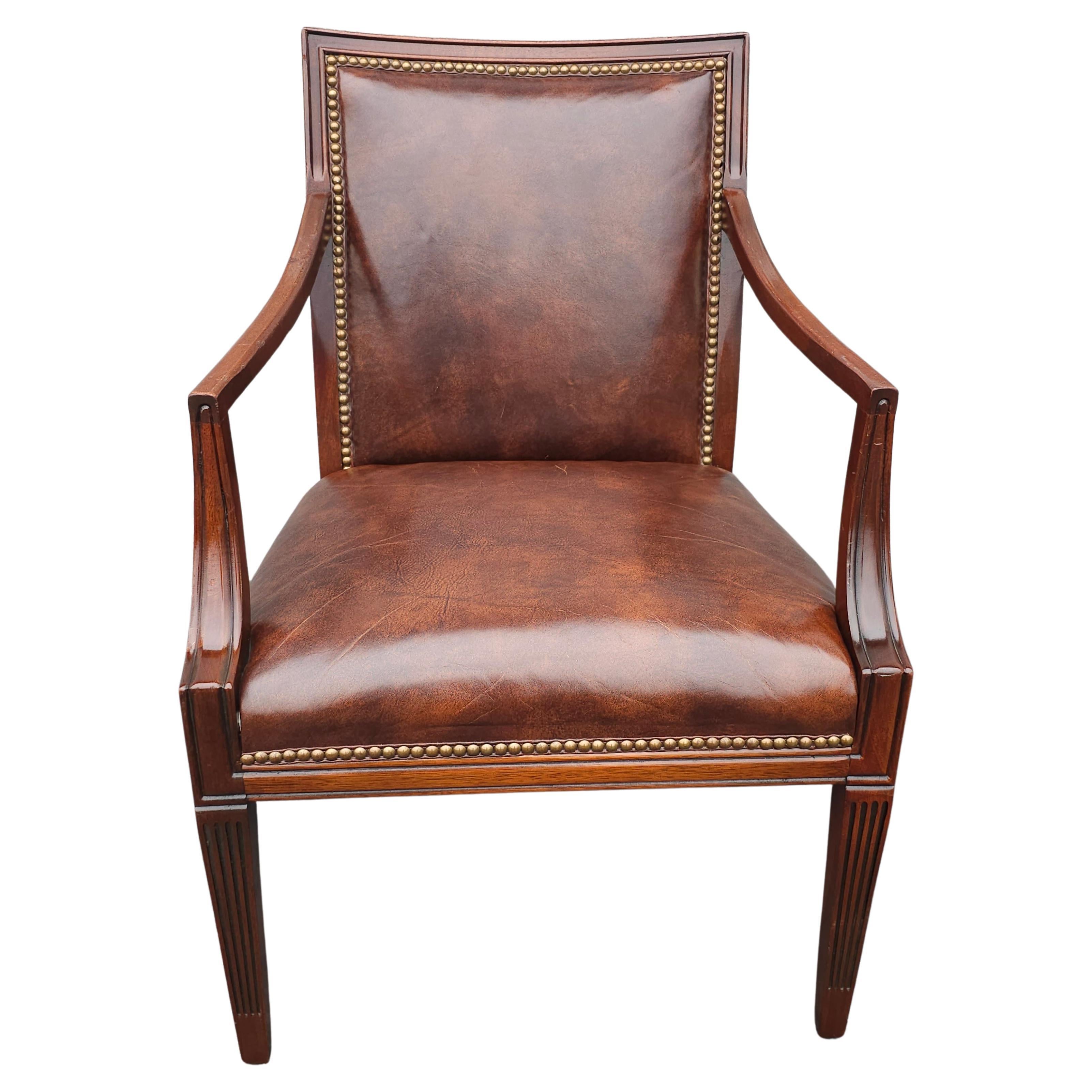 20th Century Stateville Chair Co. Mahogany and Leather Upholstered Armchair with nail head Trims. Measures 24