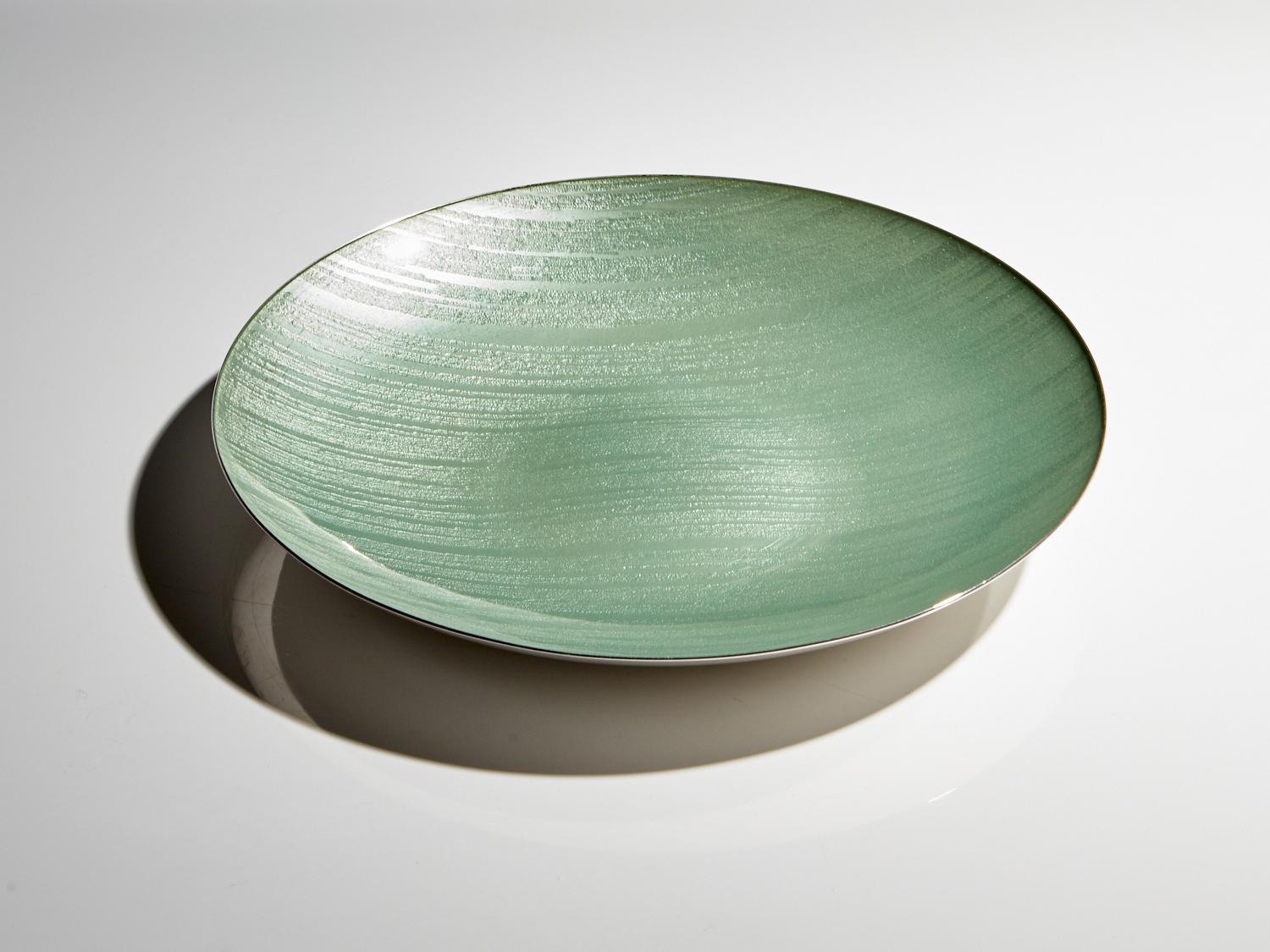 A stunning 20th century sterling silver and enamel bowl by Jacob Tostrup Date Circa 1955-60. 
This piece is a great example of quality, as with all Tostrup pieces. The bowl has a good gauge of sterling silver and the muted green enamel with under