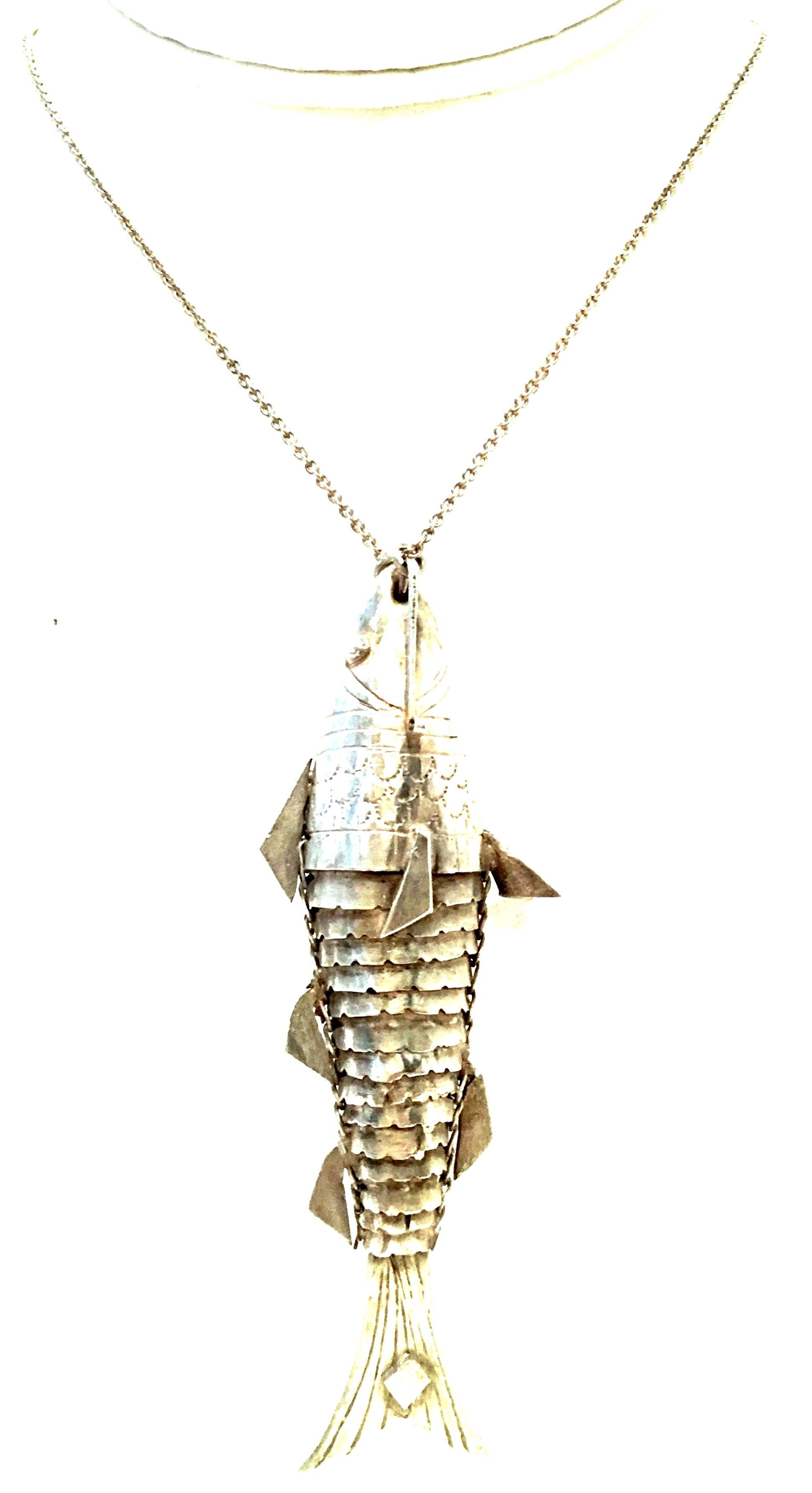 20th Century Sterling Silver Articulating Fish Pendant Necklace. Features a sterling silver chain link necklace with a large articulating fish pendant and three aqua marine beads at the clasp. The fish pendant measures approximately, 4.25