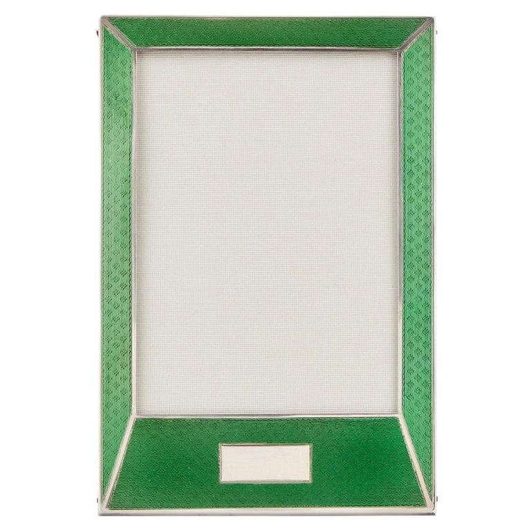 20th century Sterling silver Guilloche enamel photo frame Birmingham 1927.

This stunning 20th century Art Deco photo frame is a beautiful shape and is in excellent condition. The wonderful green enamel has a brilliant translucent quality. 

The