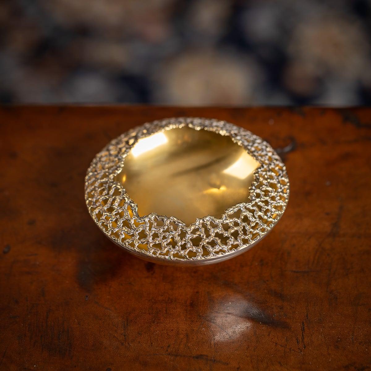 Modern 20th Century Stuart Devlin solid silver gilt cigar ashtray, the textured surface with an organically formed border, the plain bowl resting on a circular foot. Hallmarked English Silver (925 Standard), London, year 1972 (r), Maker's mark S.D
