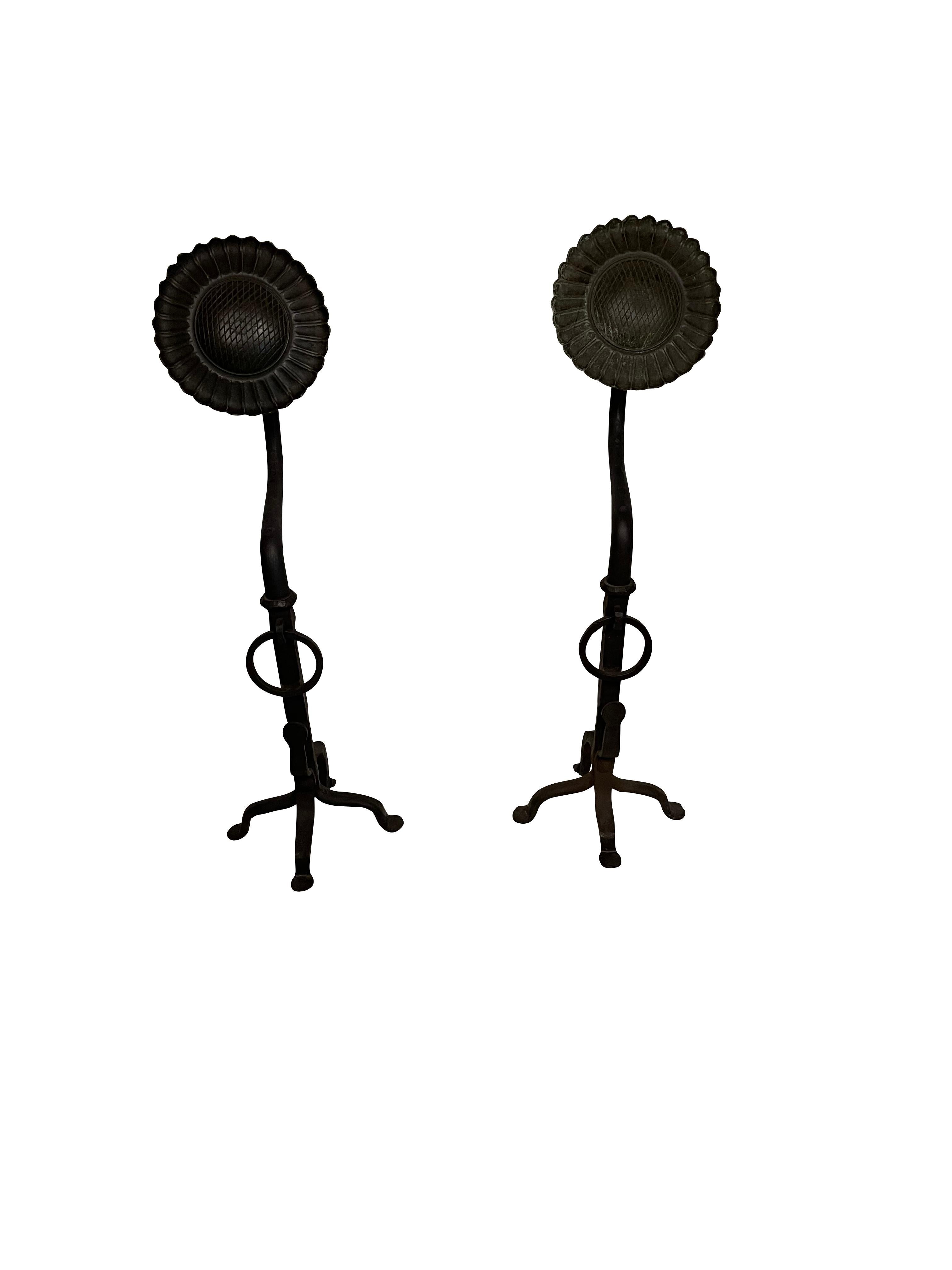 20th century wrought iron hand forged black sunflower andirons with scrolled legs and hitching post loop in the middle these spectacular andirons measure. Tall. Lovely large size.