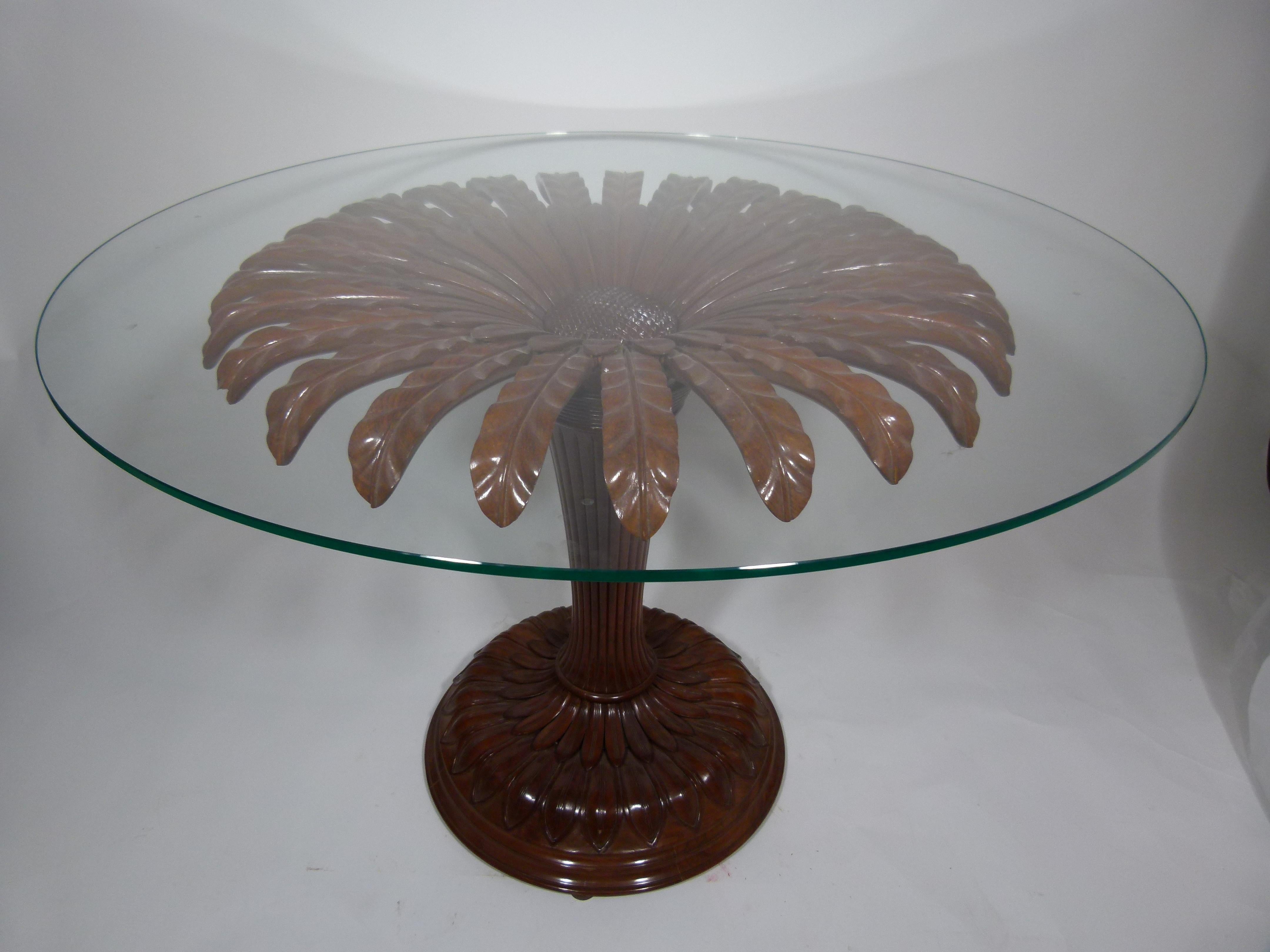 20th century sunflower wooden table with a circular rotary glass top of: 8 mm (0.31 in) thickness and 102 cm (47.24in) diameter.
The base is made of carved wood in form of a sunflower of: 90cm (35.4 in) diameter and 78cm (30.7 in) height.
The