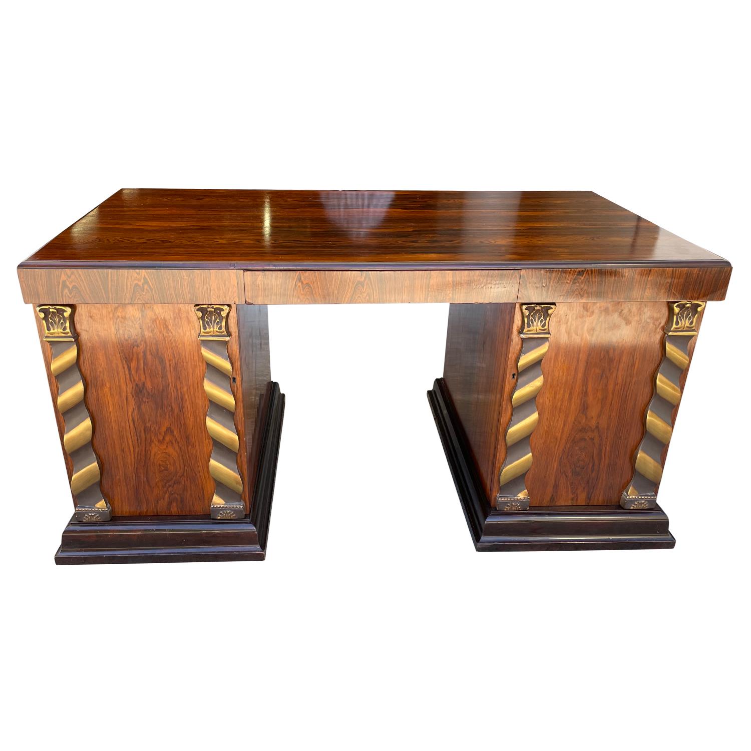 A freestanding, vintage Art Deco Swedish writing table made of hand crafted polished Jacarandawood, in good condition. The rectangular Scandinavian desk has one large drawer in the center and two cabinet doors with detailed bronze and brass inlays,