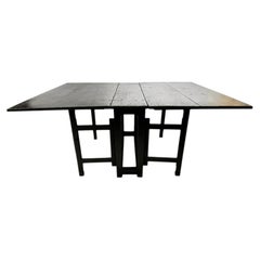 20th Century Swedish Black Painted Folding Gate Leg Dining Table.