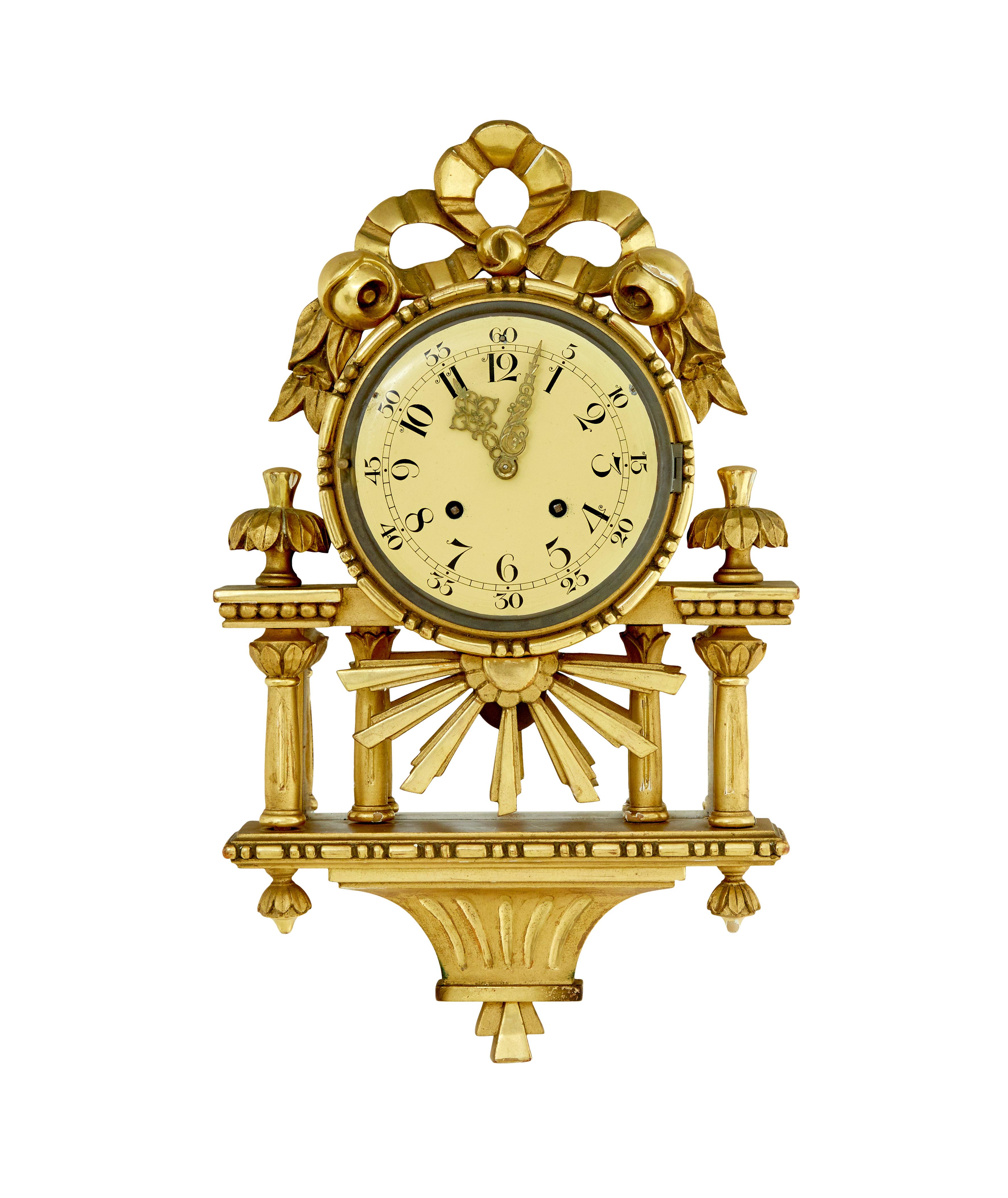 Swedish rococo revival gilt wall clock by westerstrand circa 1950.

Good quality rococo influenced clock by well known swedish maker westerstrand.

Fitted with a twin train 8 day movement and original pendulum. Enamel clock face with arabic numerals