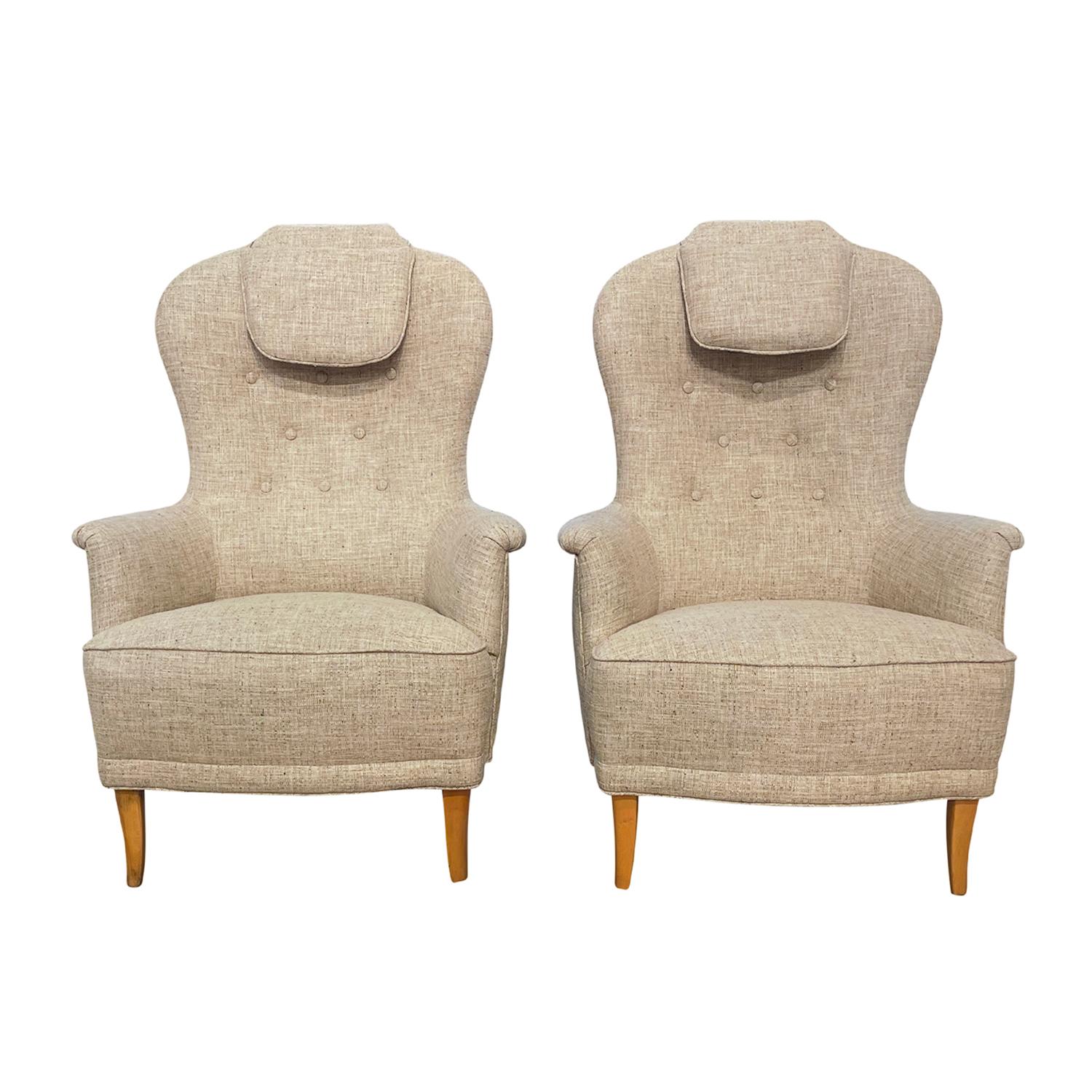 A vintage Mid-Century modern Swedish Grandma pair of armchairs designed by Carl Malmsten and produced by O.H. Sjögren, in good condition. The backrests of the Scandinavian lounge chairs are slightly inclined with a button-tufted back detailed with