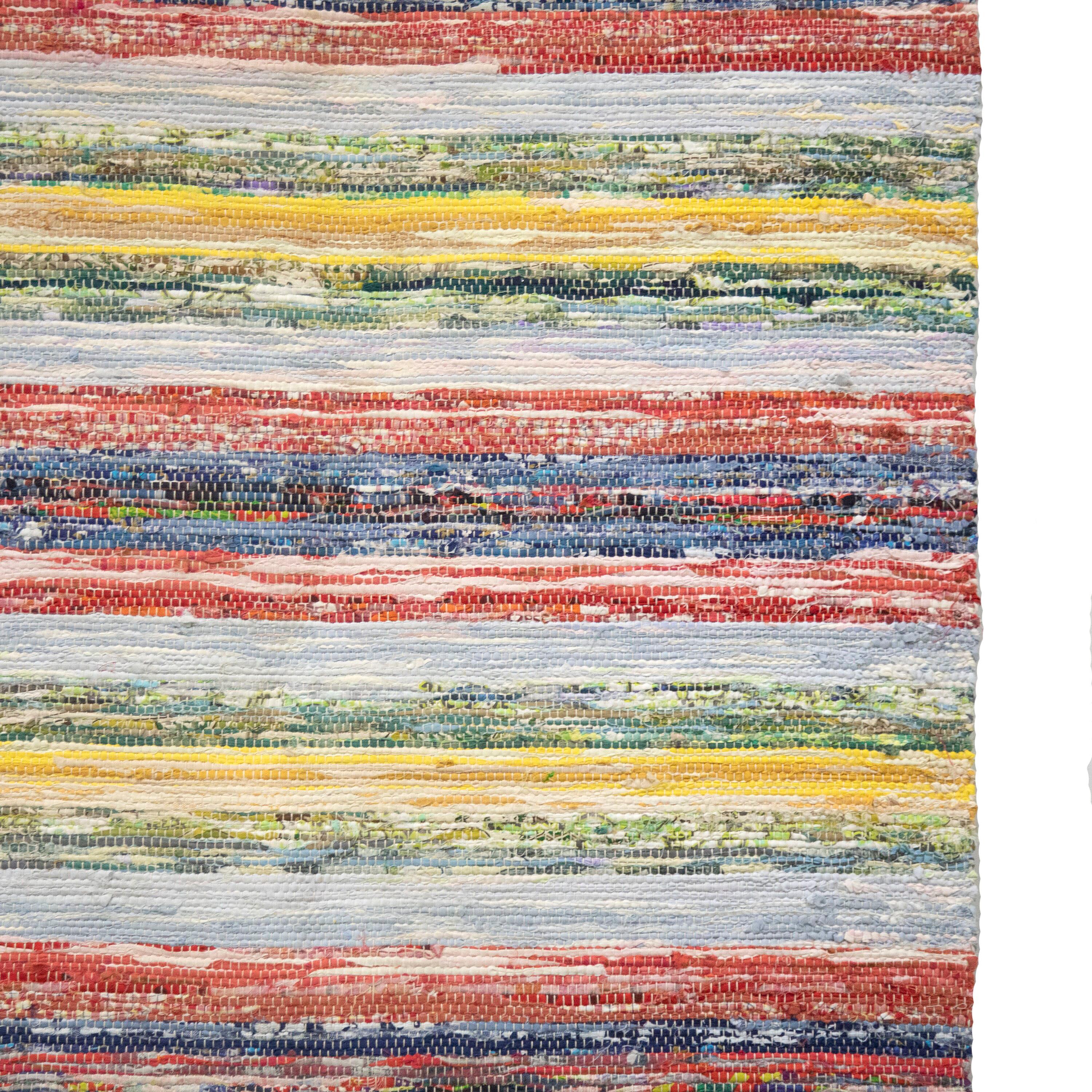 20th Century Swedish rag rug. 
Featuring a muted stripe design throughout with tones of yellow, blue, red, and green. 
This rug is machine washable at 30 degrees. 
Stock Number: RT6024468