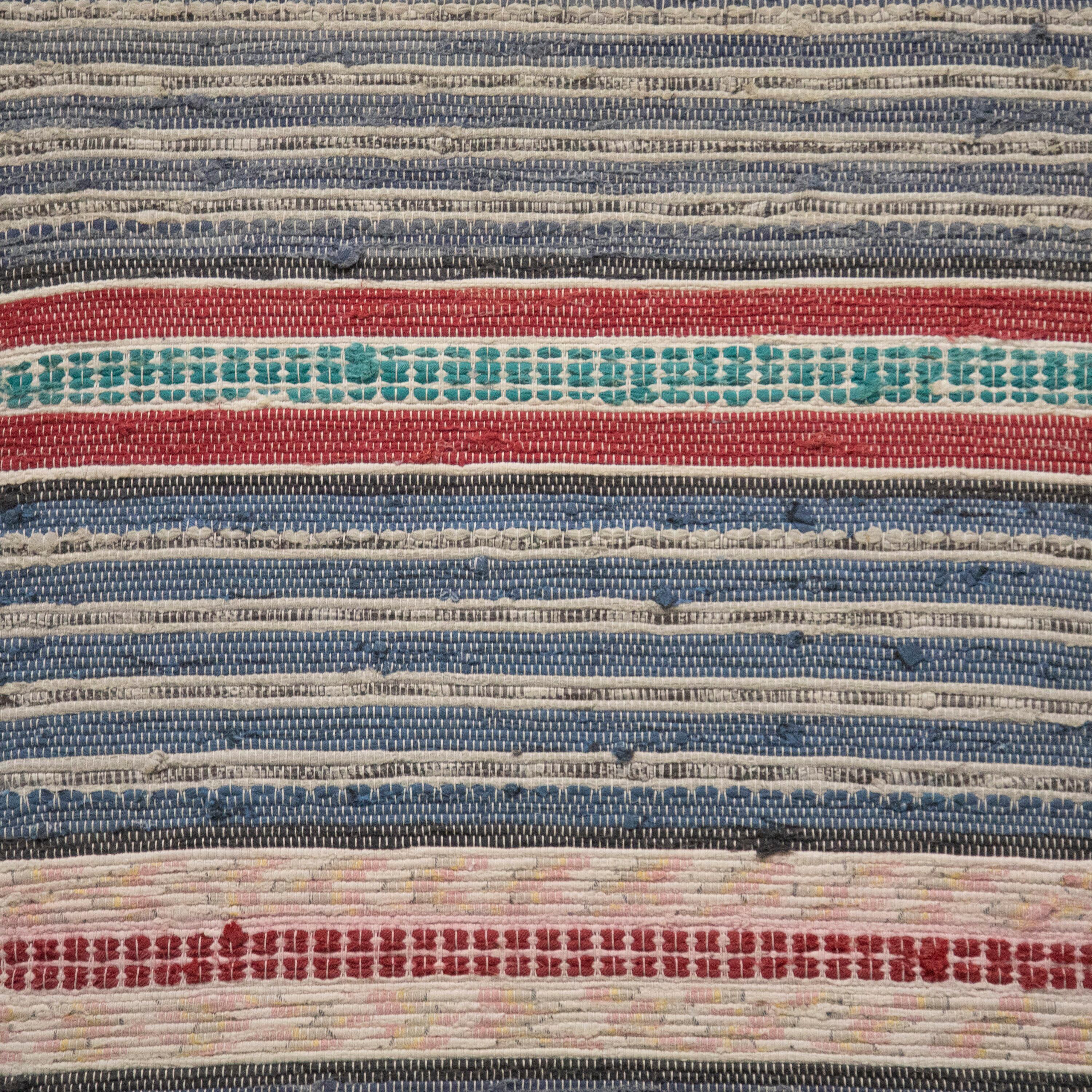20th Century Swedish rag rug. Featuring a stripe design in tones of blue, red, and jade. This rug is machine washable at 30 degrees.
RT6024481