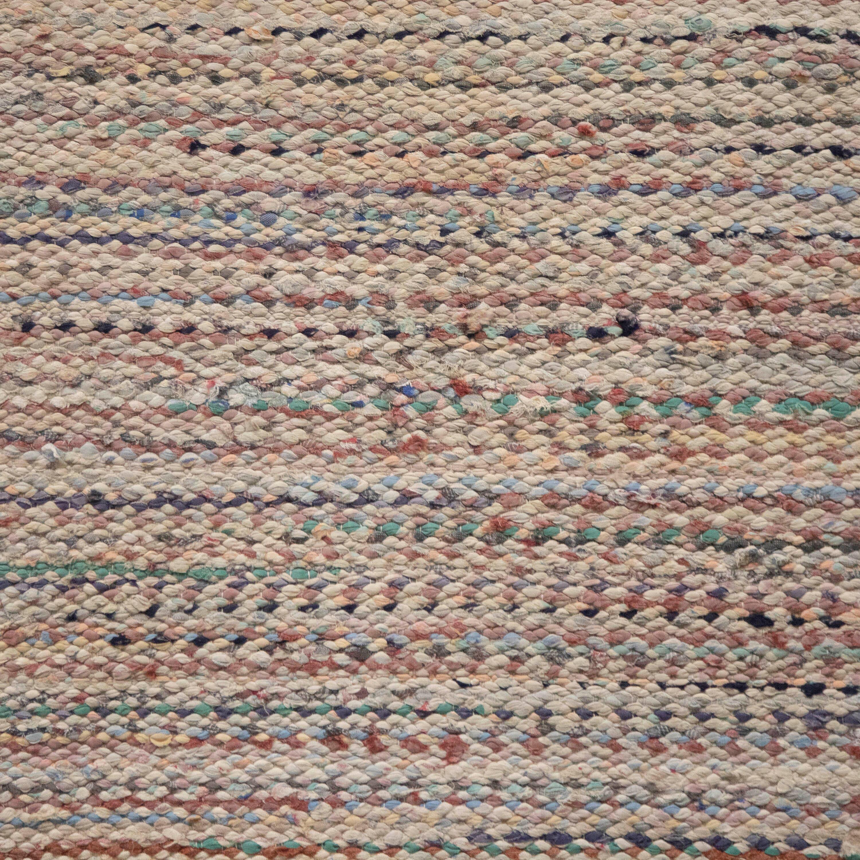 20th century Swedish rag rug. Featuring a stripe design in muted tones of green, red, and ecru. This rug is machine washable at 30 degrees.
RT6024603