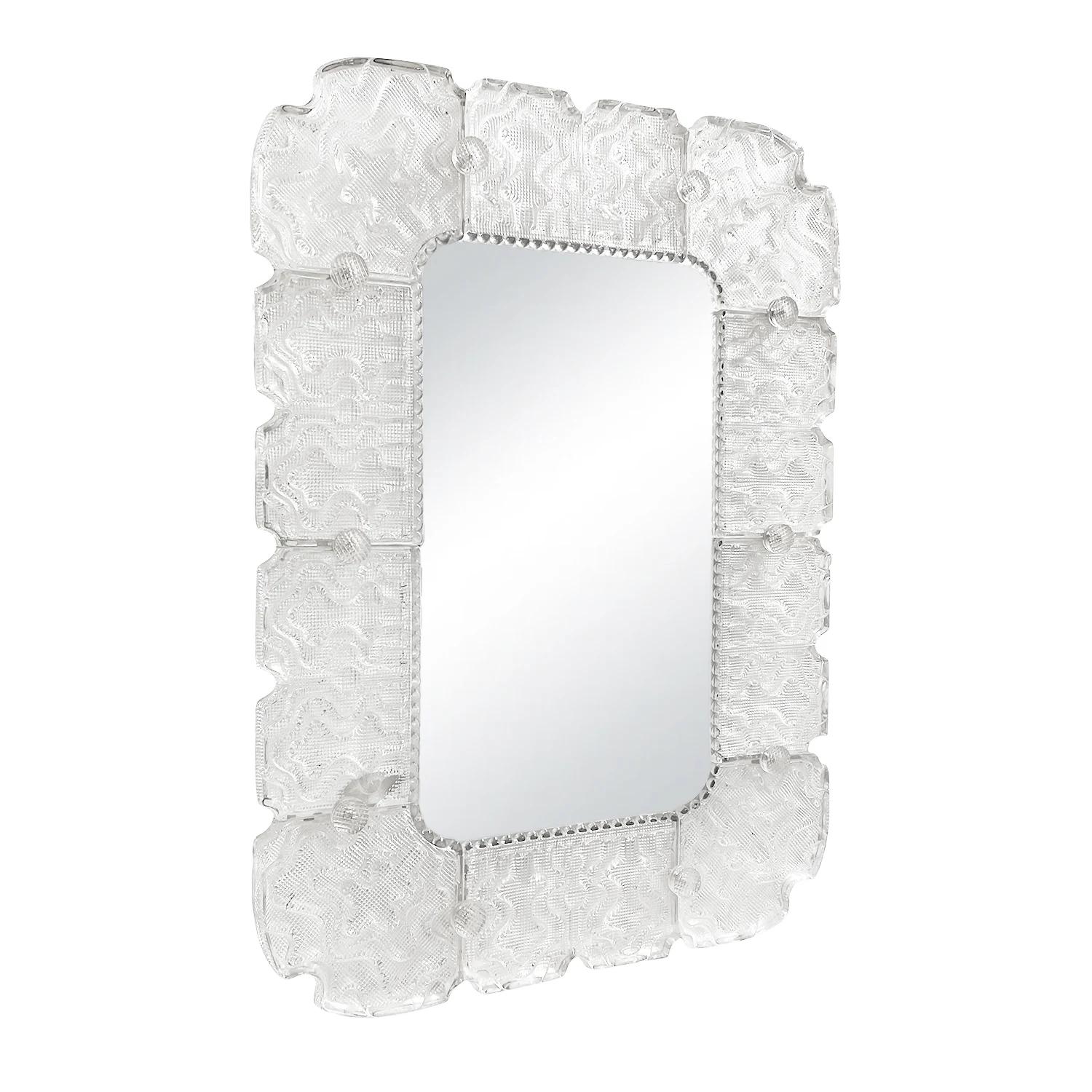 A rectangular, vintage Mid-Century modern Swedish wall mirror with its original mirror glass, made of hand blown smoked Orrefors glass, designed by Carl Fagerlund and produced by Orrefors in good condition. Each glass piece of the Scandinavian wall