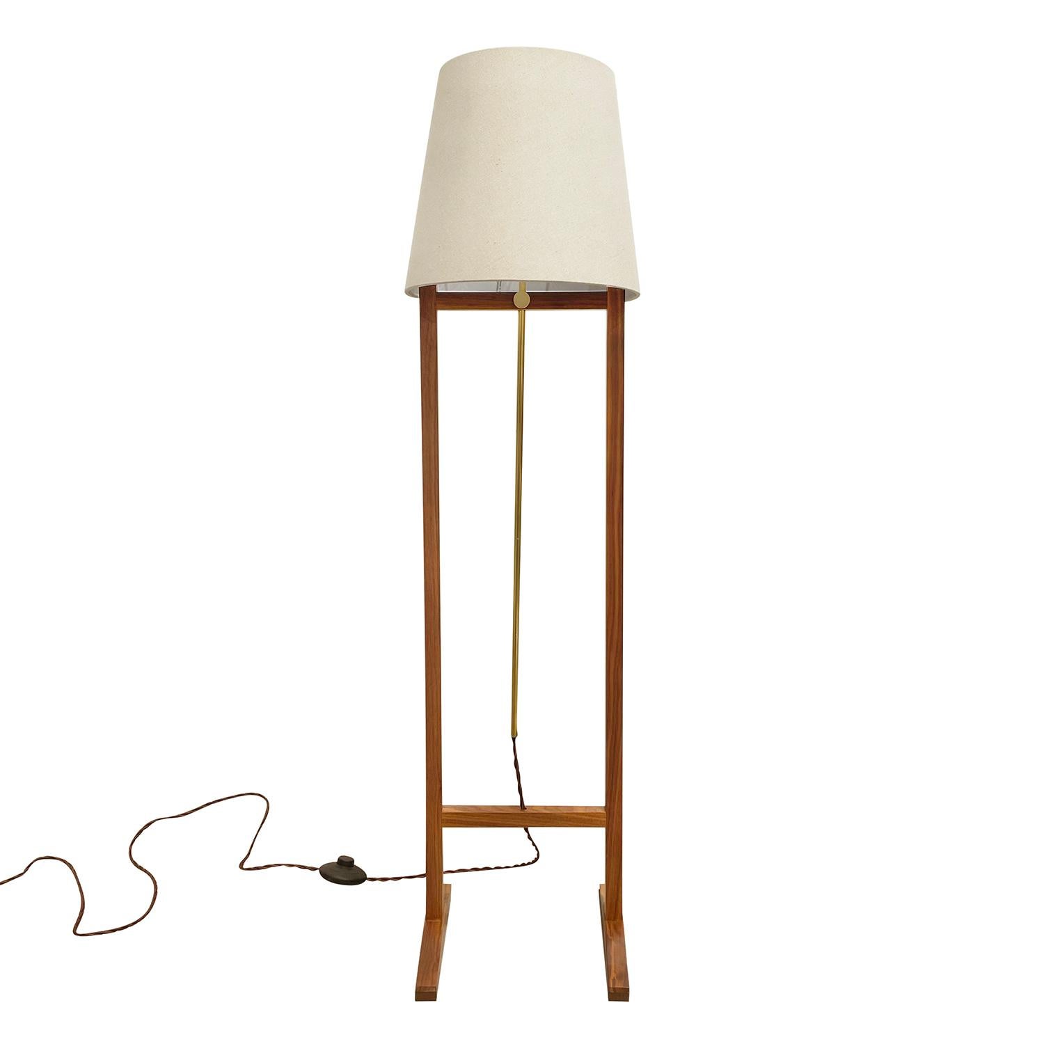 A light-brown, vintage Mid-Century Modern Swedish adjustable floor lamp with a new beige round shade, made of handcrafted Walnut, designed by Josef Frank and produced by Svenskt Tenn, in good condition. The height of the Scandinavian light is