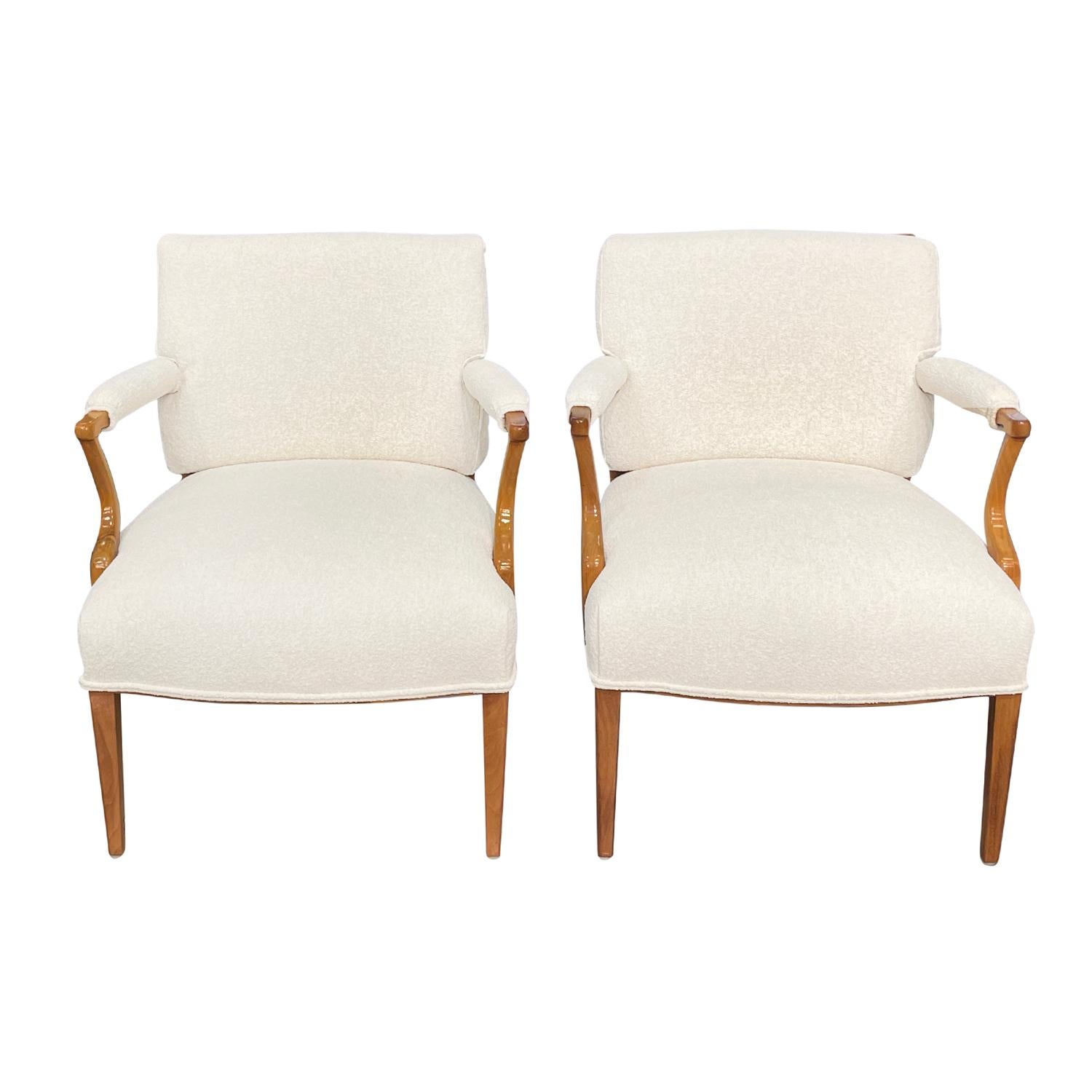 A vintage Swedish Art Deco pair of armchairs made of hand crafted polished Beechwood, designed by Josef Frank for Svenskt Tenn in good condition. The set of two Scandinavian dining room chairs have a slightly reclined backrest which is enhanced by a