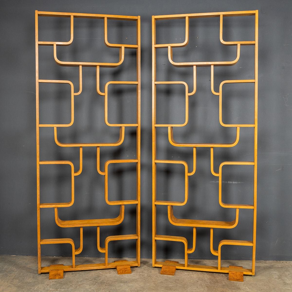 Versatile pair of teak book shelves and room dividers, beautifully curved, very tall and perfect to divide a large open space, wide enough to be used as shelving, a very stylish and versatile piece of modernist design. Created originally by Czech