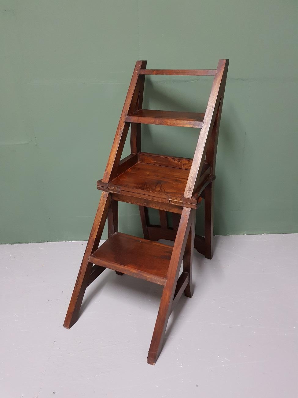 Teak wooden library step chair two in one after antique examples, it is in good condition and made late 20th century.

The measurements are:
Depth 36 cm/ 14.1 inch.
Width 42.5 cm/ 16.7 inch.
Height 89 cm/ 35 inch.
Seat height 44.5 cm/ 17.5