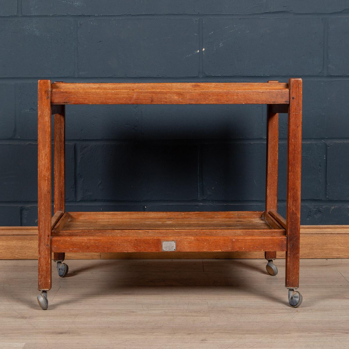 A teak two-tier drinks or tea trolley made from reclaimed timber by Hughes Bolckow Ship Breaking Company Limited, the teak taken from the timber of RMS Arlanza. RMS Arlanza was a 14,622 GRT ocean liner of the Royal Mail Steam Packet Company. She was