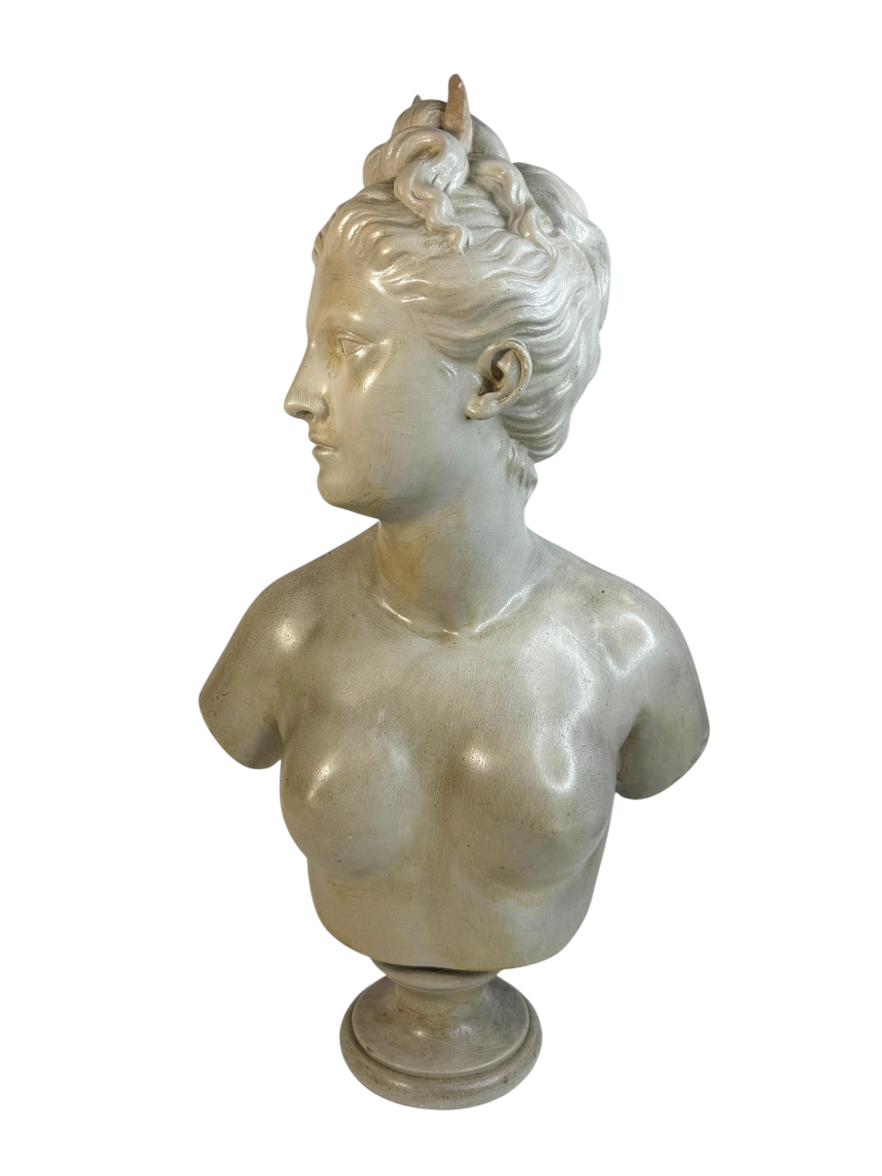 This is an impressive bust formed with terracotta of Diana Goddess of the Hunt. This beautiful sculpture is hand formed, 20th century. Signed by Artist but can not identify the maker. It makes a nice addition to any room. Found at an Estate Sale in