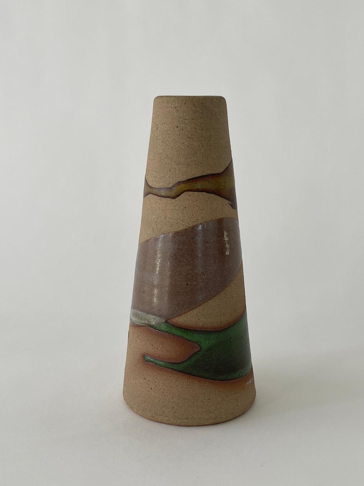20th century textured and glazed vessel with a unique painted and glazed design. Heavy construction with a rough textured and smooth glazed ceramic exterior.