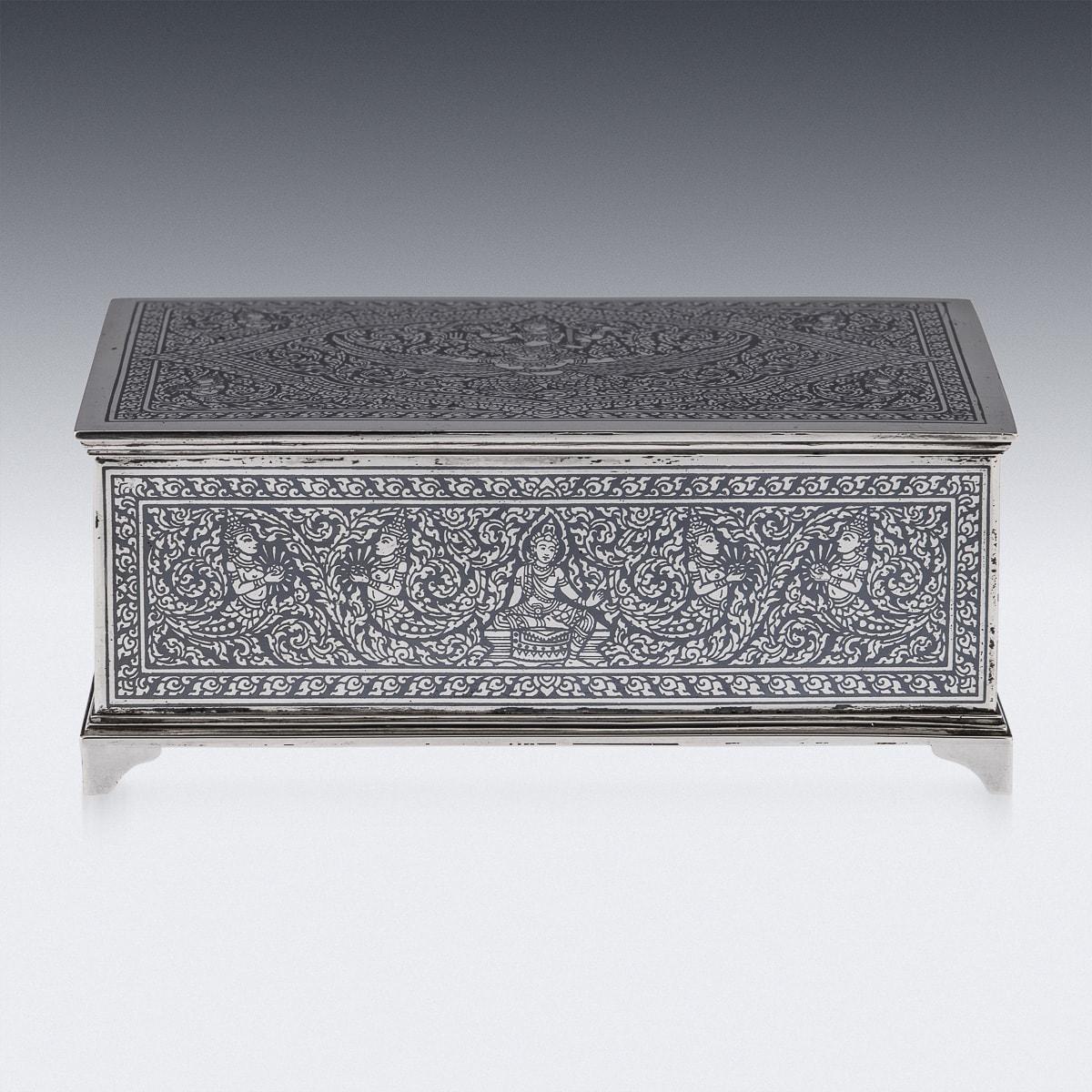 Beautiful mid-20th Century Thai solid silver niello box, decorated throughout with stylised leaves and deities on polished ground, standing on four shaped feet. Tested Sterling (925+ standard), Makers Unknown, probably made in Bangkok. Nielloware