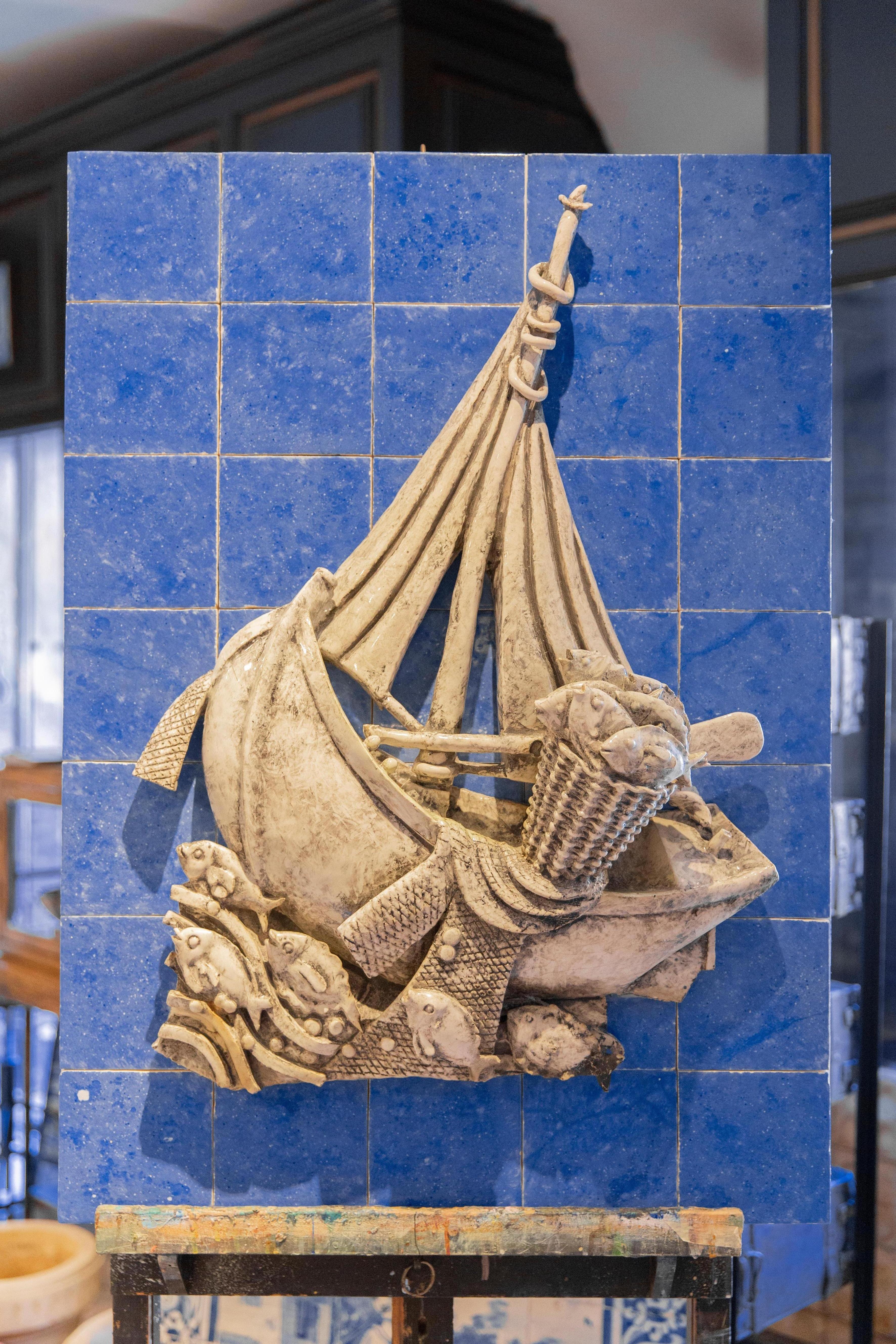 Midcentury Boat Ceramic Portuguese Azulejos Tile Mural after Jorge Barradas

Portuguese azulejos with fishing boat sculpture in white glazed faience, circa 1960,
attributed to Jorge Nicholson Moore Barradas (Lisboa, 1894 – Lisboa, 1971).
Jorge