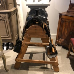 20th Century Tooled Leather Saddle and Rustic Wood Stand