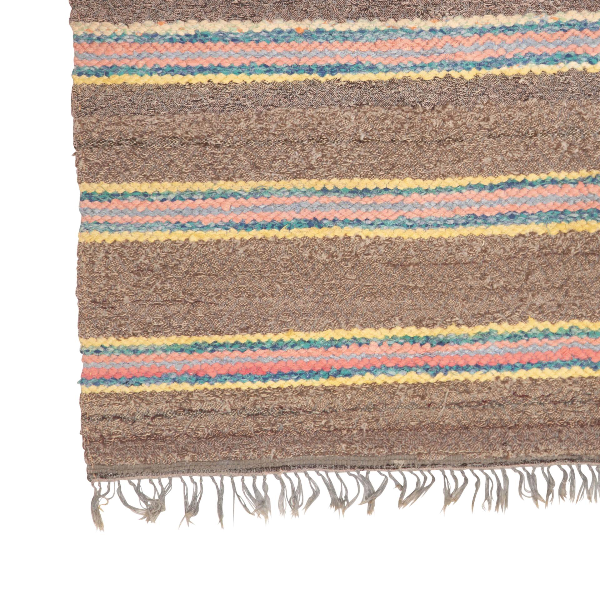 20th century traditional Swedish rug, browns, pinks, orange, blue, yellow.