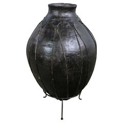 Used 20th Century Tribal Large Scale Clay Fermenting Pot or Water Jug Black on Stand