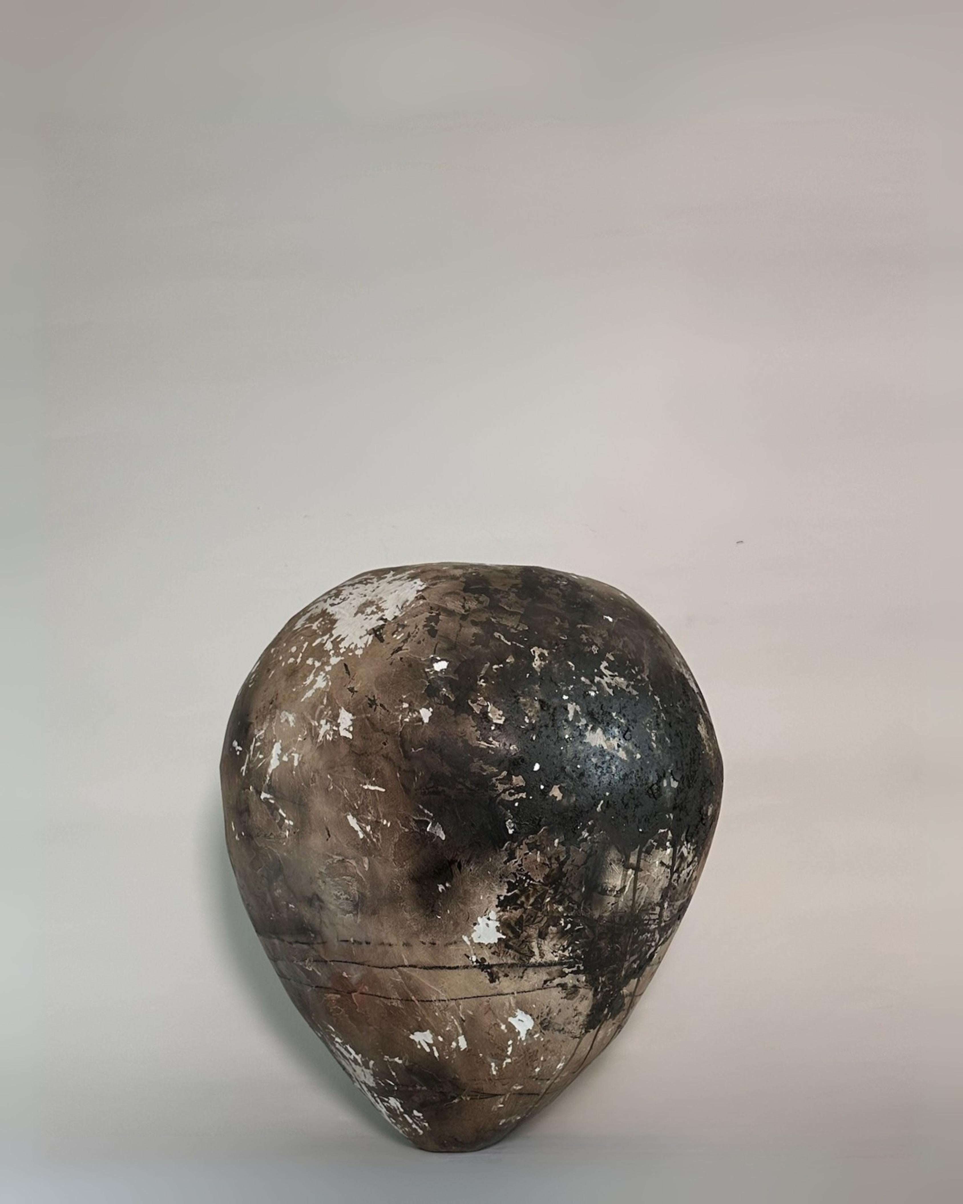 This sculptural vessel by Maison Lamiè Studio captures the quiet drama of ancient Turkish ceramics while offering a contemporary interpretation. Handcrafted in the 21st century, it is designed to mimic authentic 20th-century Turkish pots, with a