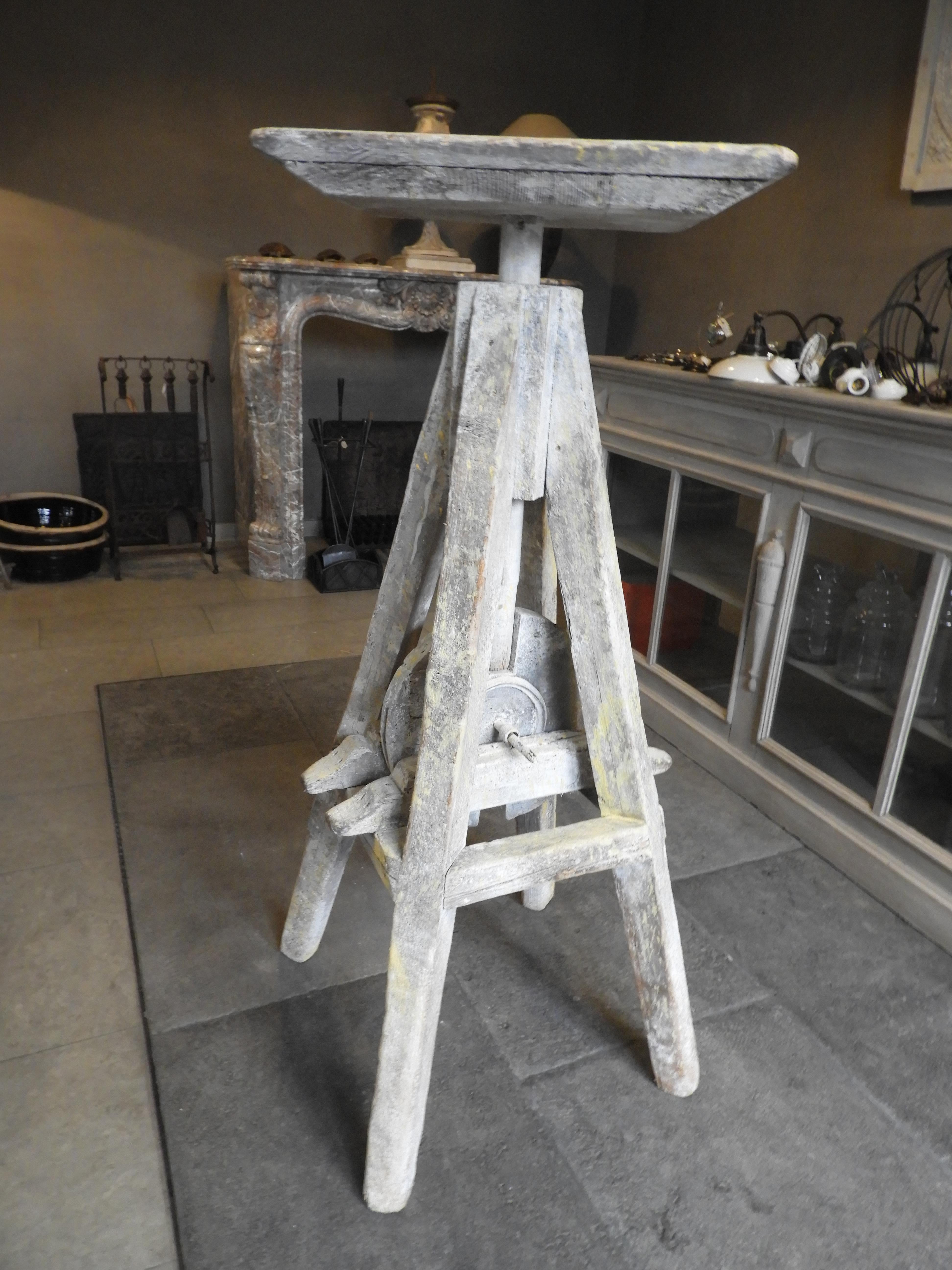 20th century turnable and in height adjustable sculptures working table in its original warn patina.