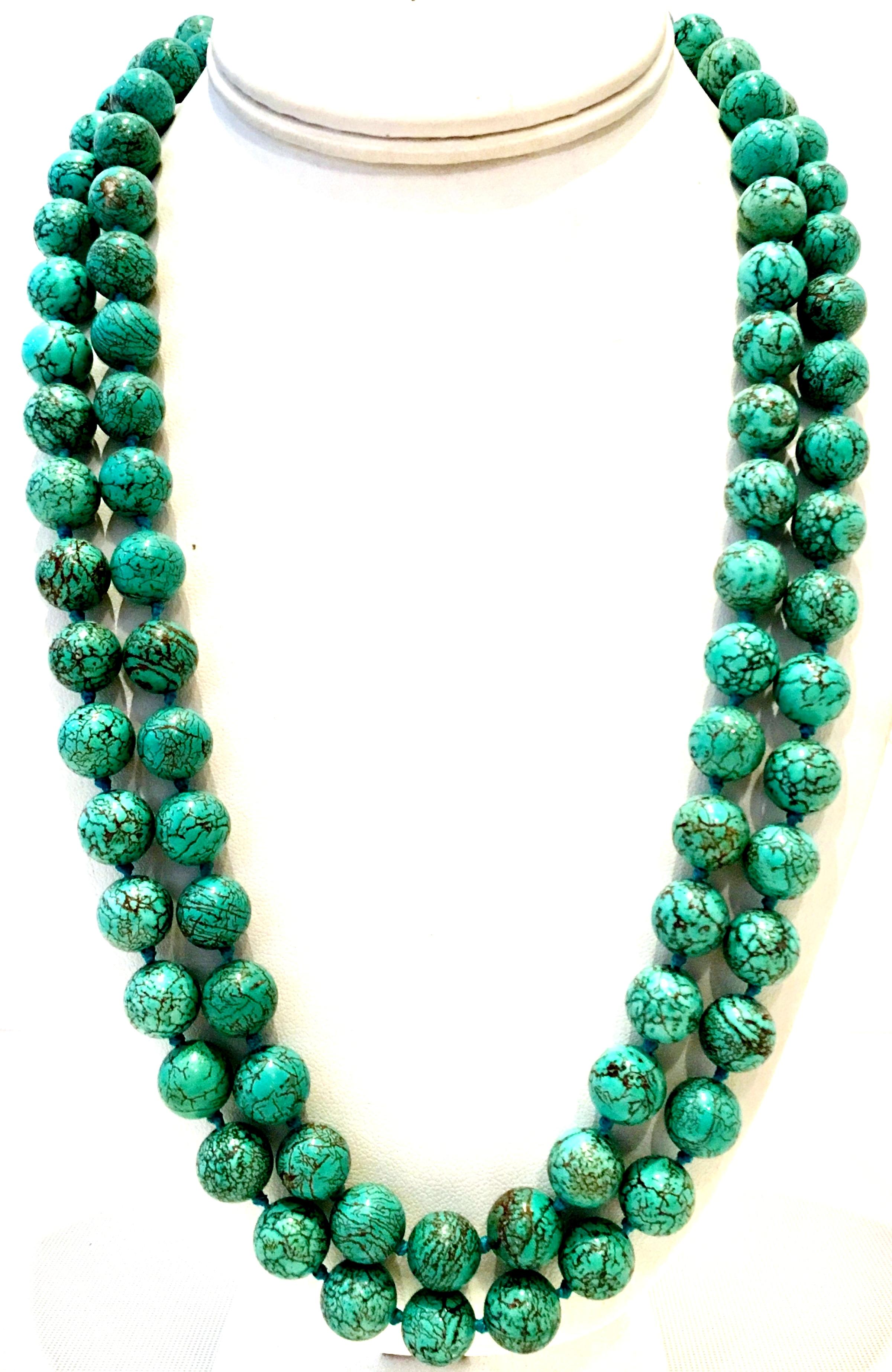 20th Century Authentic Natural Polished Turquoise Bead Opera Length Necklace. This rare and pristine piece features polished turquoise beads with lovely natural brown veining. Each bead is approximately .50
