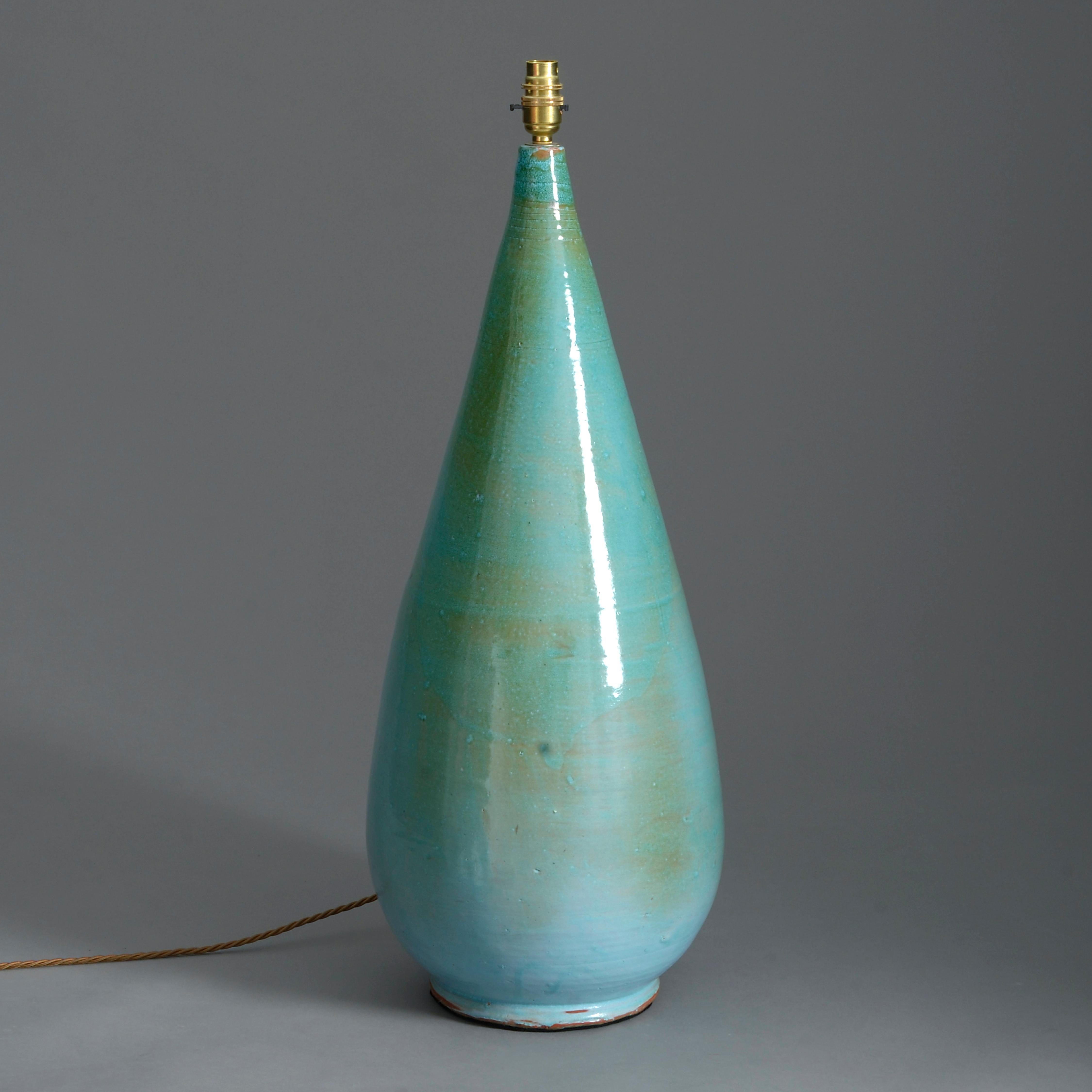 A tall mid-20th century Studio Pottery vase, the body with a striking variegated turquoise glaze.

Dimensions refer to ceramic elements only.