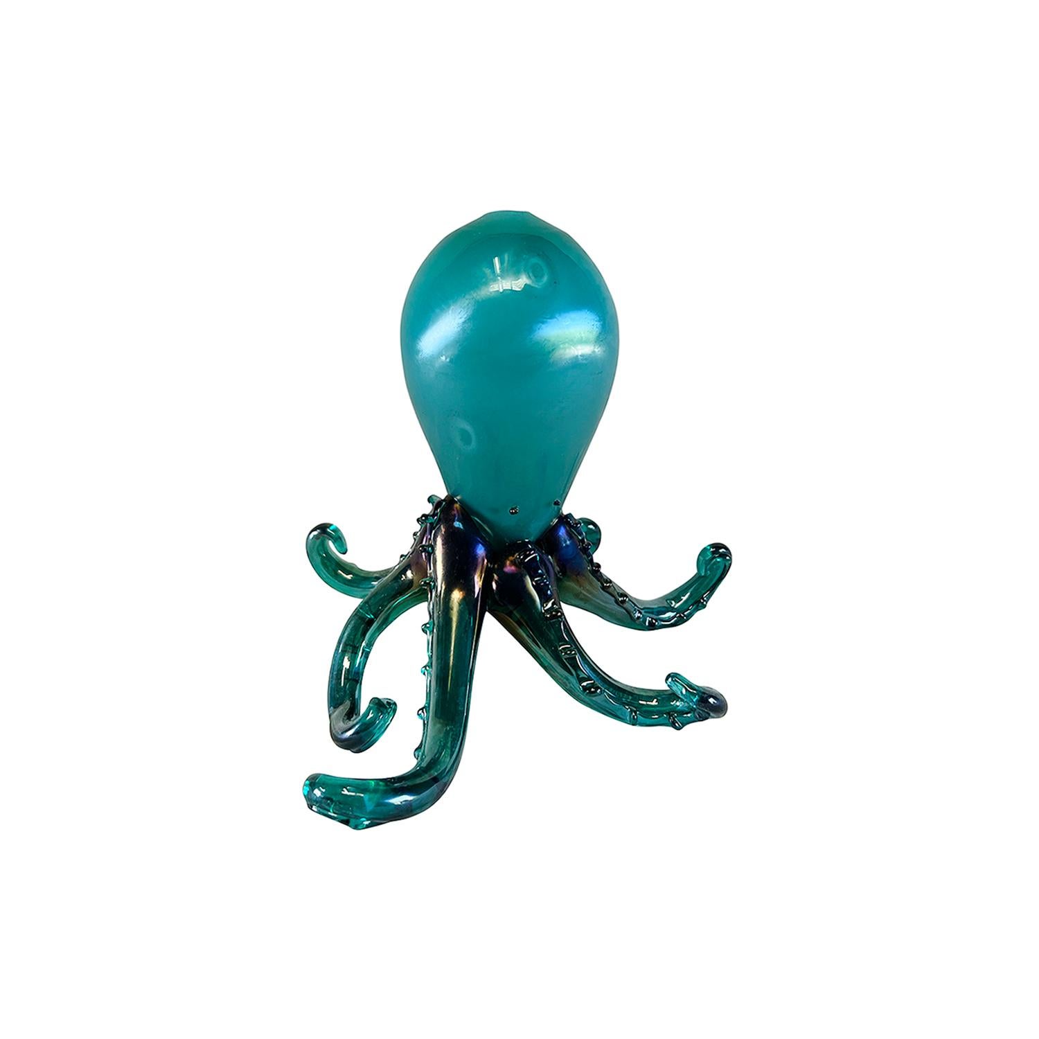 A turquoise-green, vintage Mid-Century modern Italian octopus sculpture made of hand blown colored Murano glass, designed by Carlo Scarpa and produced by M.V.M. Cappellin & Co. in good condition. Wear consistent with age and use. Dated 1929, Murano,