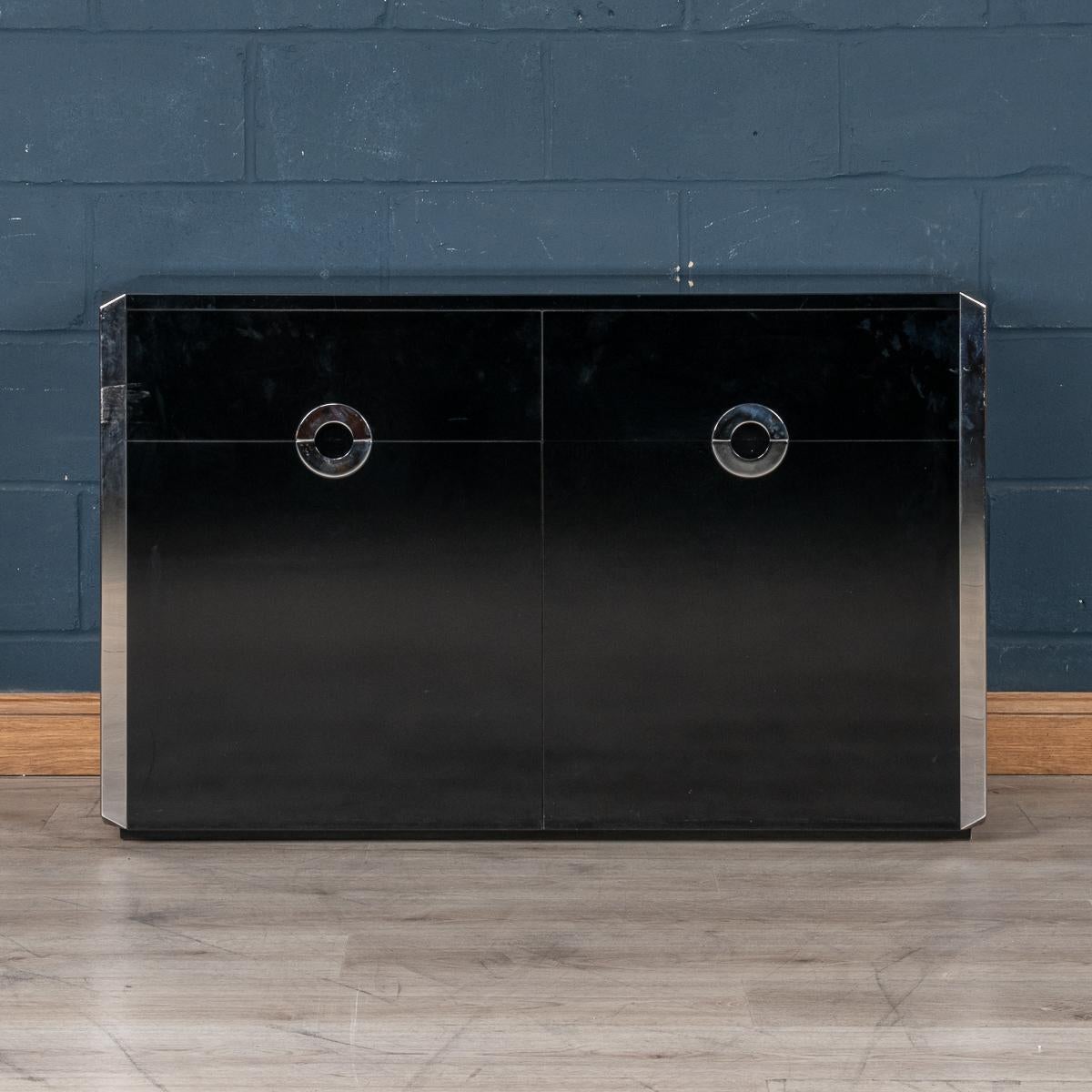 An elegant two-door sideboard designed by Willy Rizzo for Mario Sabot, produced in Italy in the 1970s. The gloss finish laminate veneer is beautifully accentuated by mirror polished stainless steel handles and edging. The two doors open 180 degrees