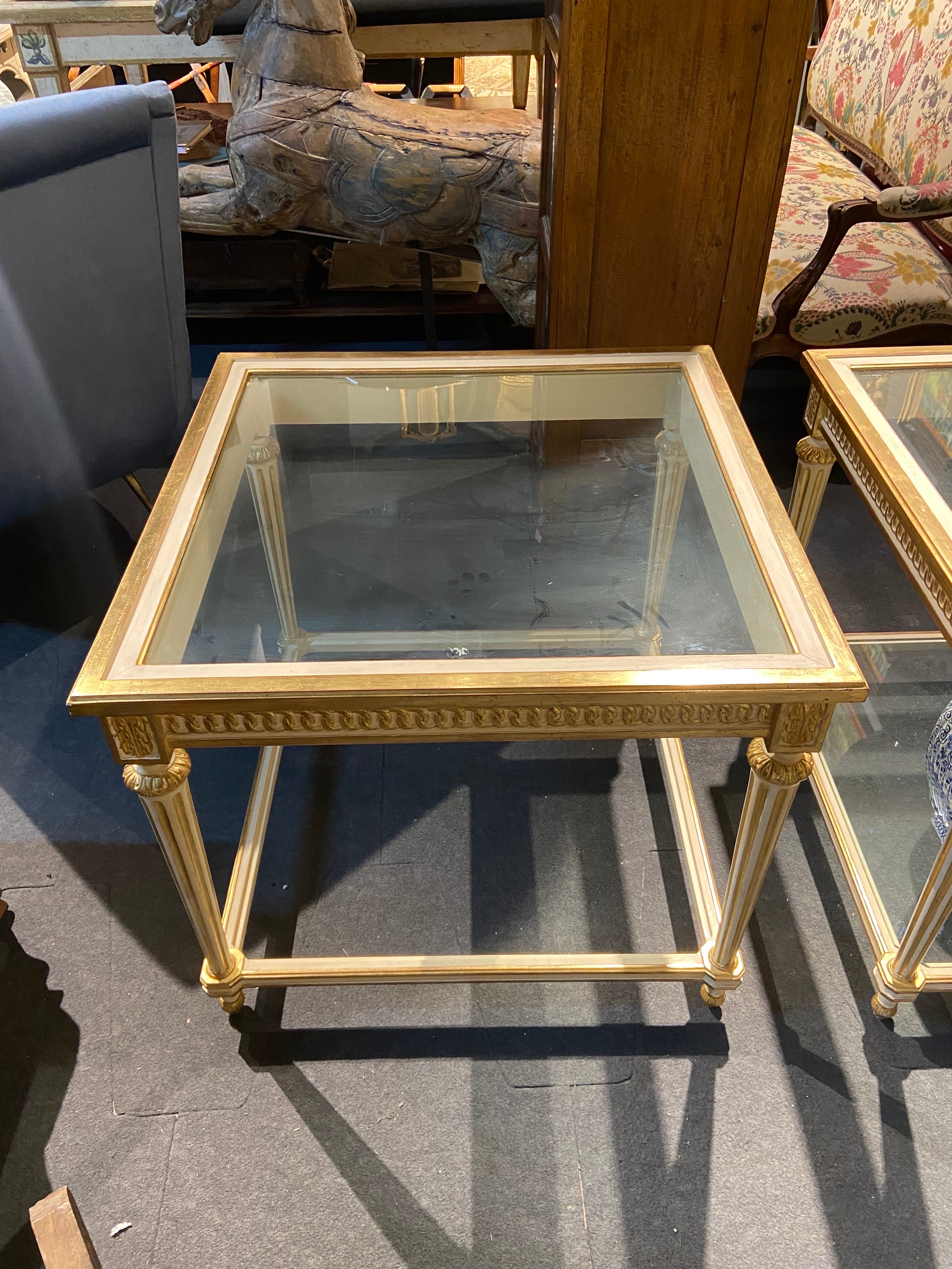Two identical square sofa tables in gilt wood frame with two levels in glass top. Very practical and useful size with delicate frame which makes them look almost invisible and on the other hand you may place a lot of books and small items on both
