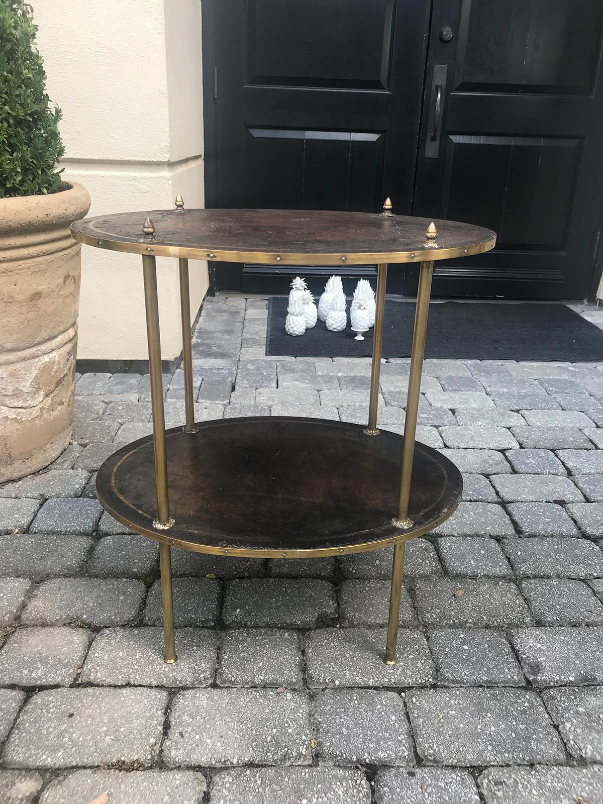 20th century two-tier oval leather and brass side table.