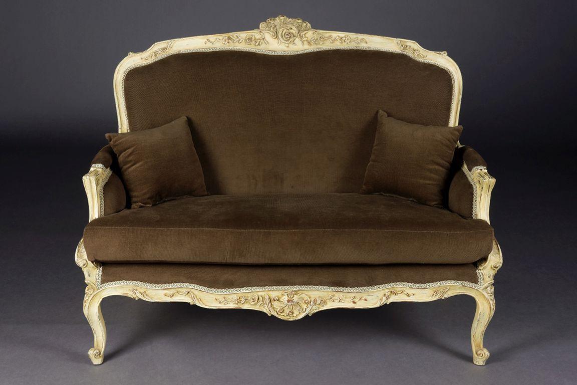 Solid beechwood, carved and set. Semicircular rising backrest frame with openwork rocaille crowning. Appropriately curved frame with rich relief carved foliage. Slightly curved frame on curly legs. Seat and backrest are finished with a historic,