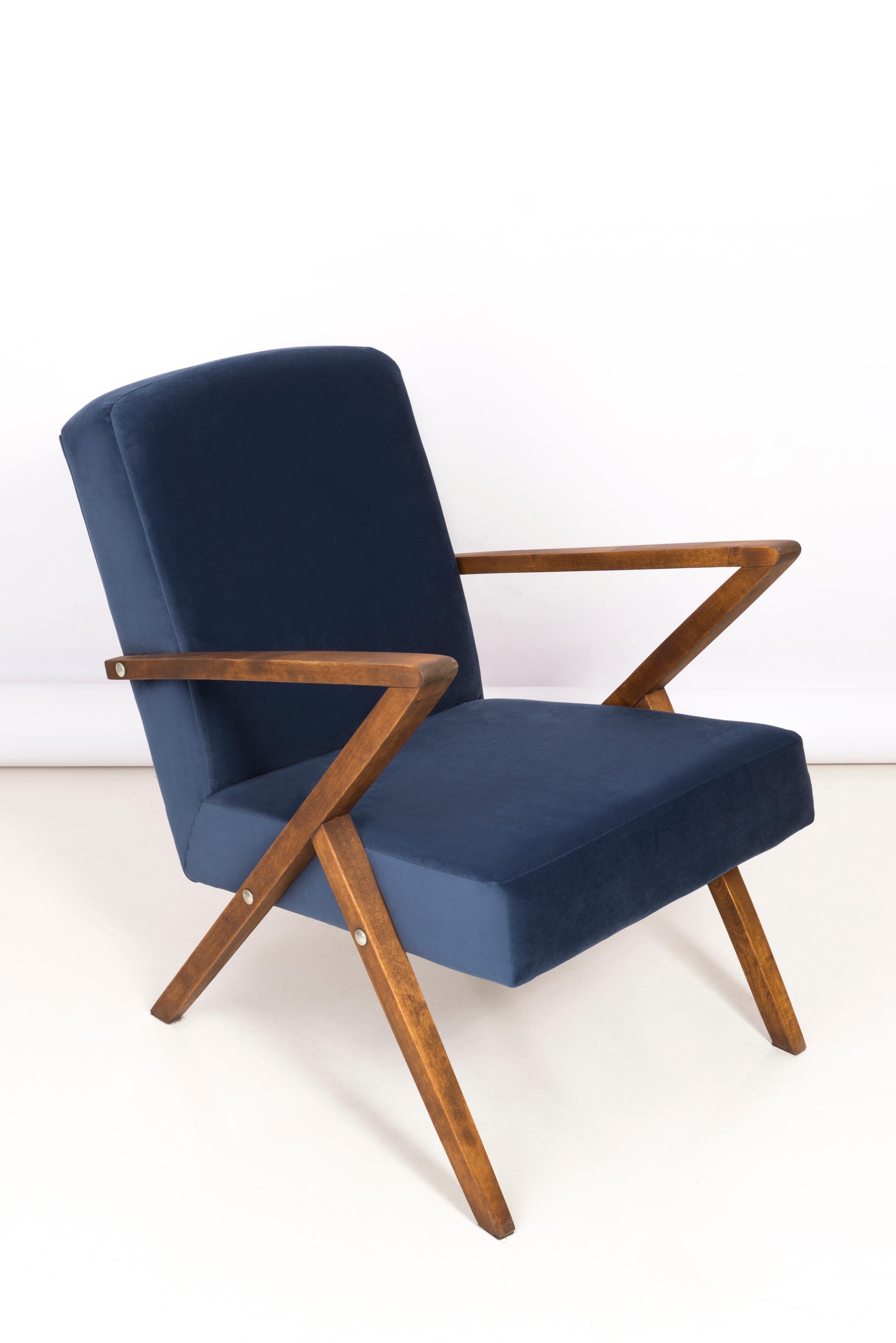Armchair manufactured at the Bydgoszcz Renewal Cooperative in the 1970s. The armchair are after a comprehensive renovation of carpentry and upholstery. The wood has been cleaned, cavities completed, painted with dark walnut stain, finished with