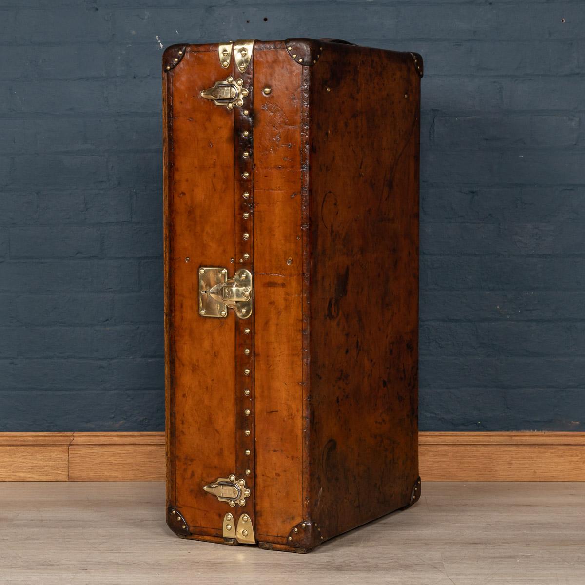 One of the most popular and sought after Louis Vuitton trunks, a wardrobe trunk finished in cowhide leather, dating to the early part of the 20th century. These coverings were custom orders with Louis Vuitton, made from a single sheet of the finest