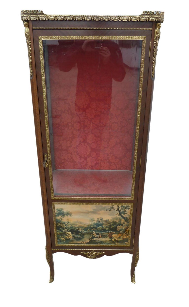 For sale is a very good quality Vernis Martin cabinet made by H & L Epstein. The cabinet has highly decorative ormolu mount sand opens to reveal two adjustable glass shelves. The cabinet is in very good condition and was made during the