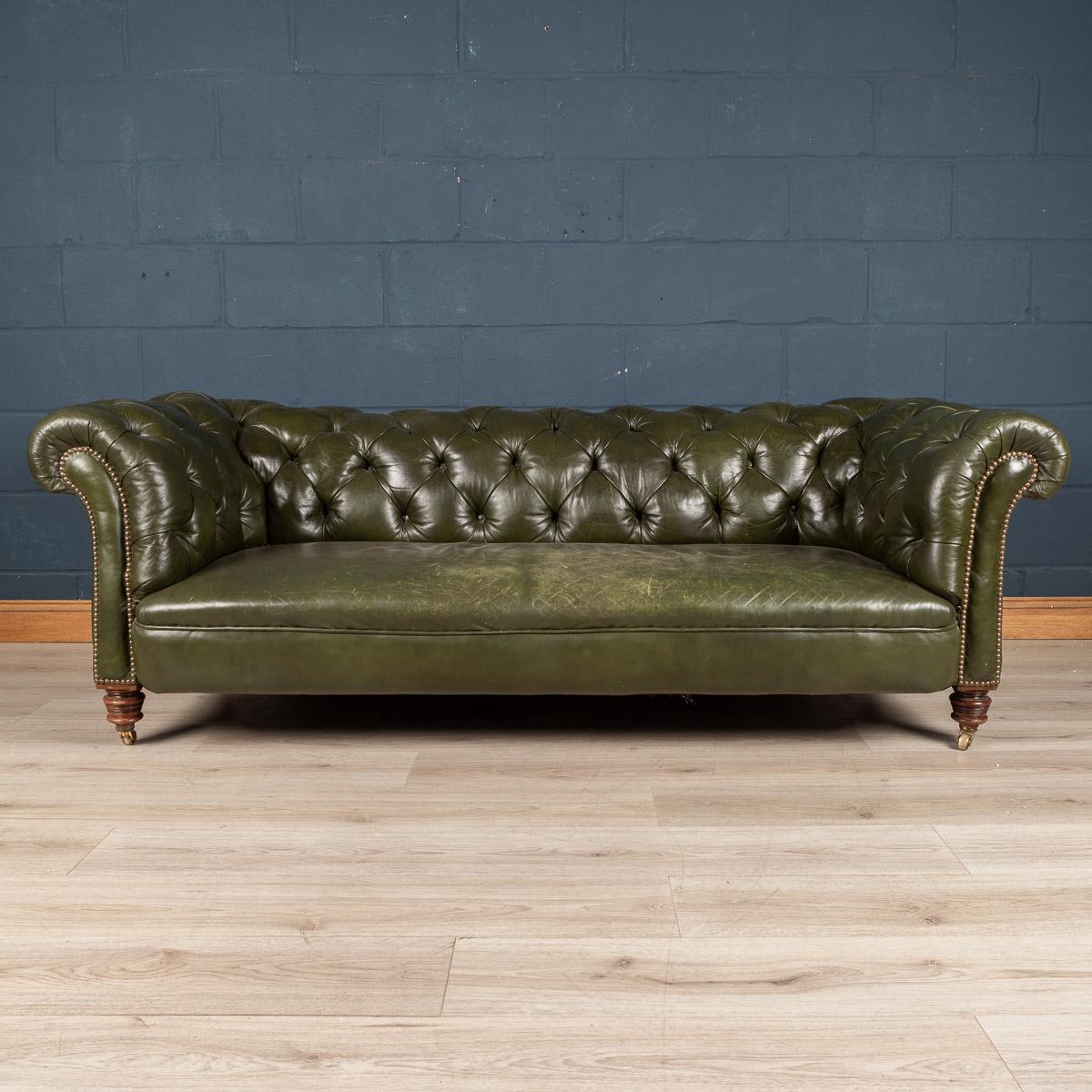 A traditional Victorian three seater leather chesterfield sofa. Lovely patina on the green leather, all hand crafted and on original brass castors. it is of the finest quality and oozes charm and style. Perfect for any interior, both modern and