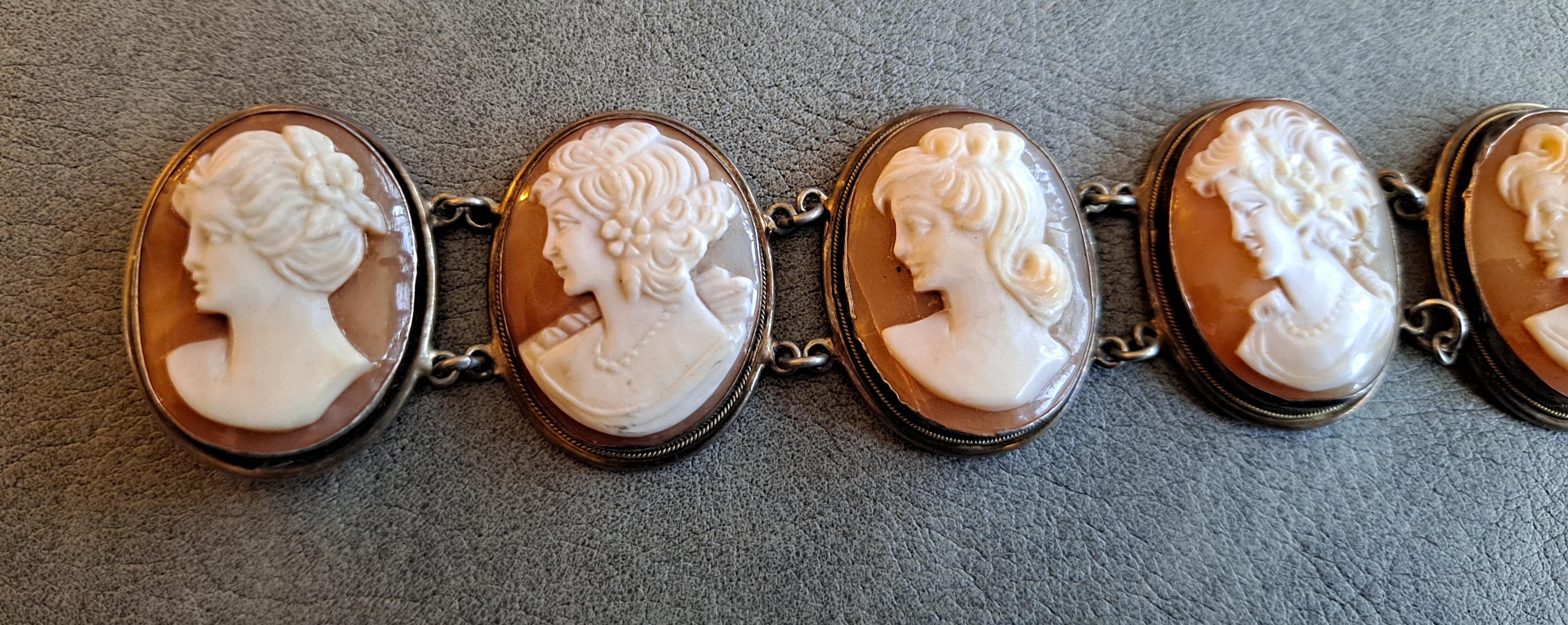 20th Century Victorian Revival Bracelet Set in Sterling Sliver Frames

7  high relief cameos carved from Bull mouth Shell 

Box Clasp 

7.5