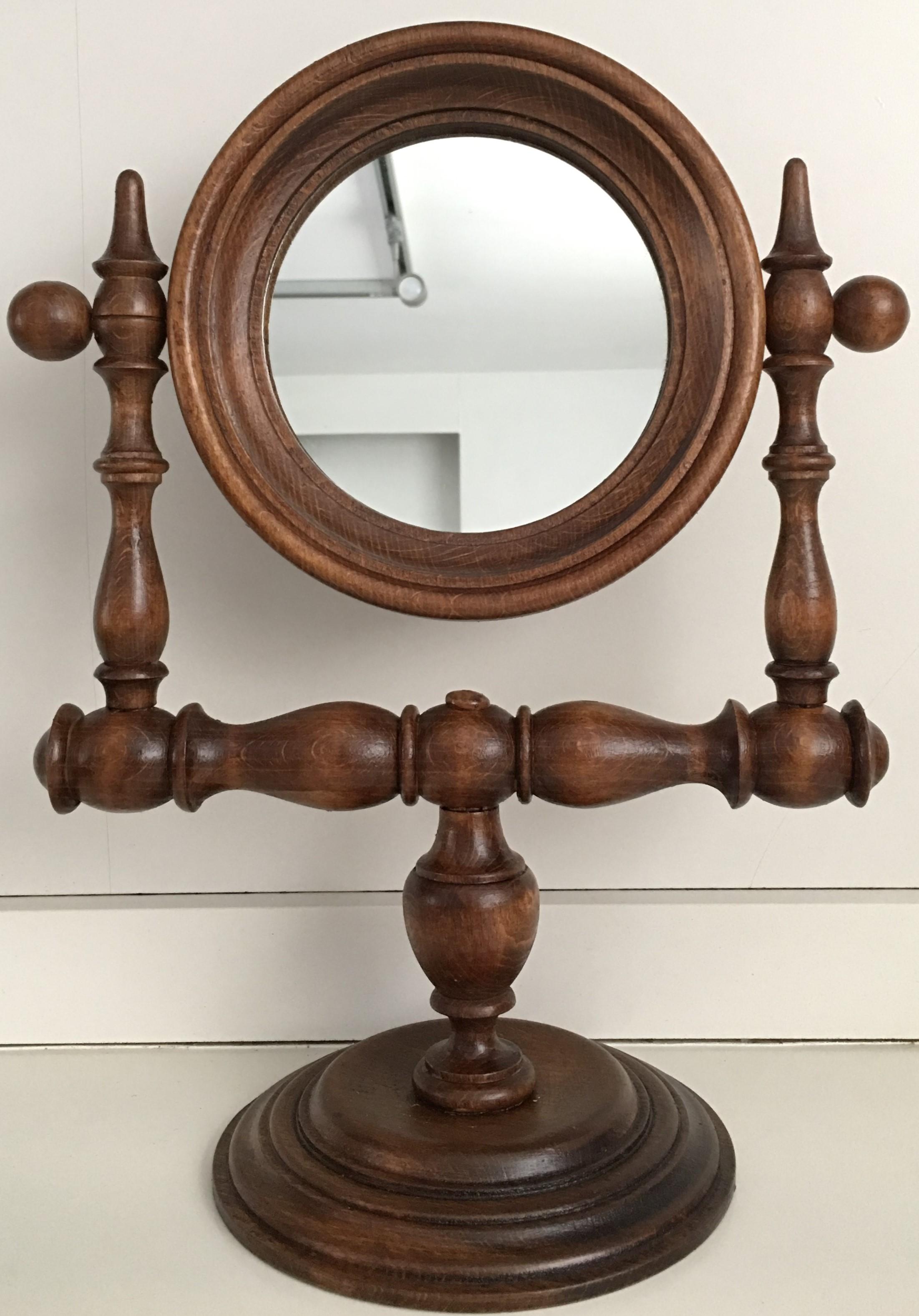 20th century Victorian walnut dressing table mirrors, France
A lovely Victorian walnut shaving stand, circa 1880. Having an adjustable beveled edge mirror which is nicely framed with the lipped edge standing above the circular stand with a reeded
