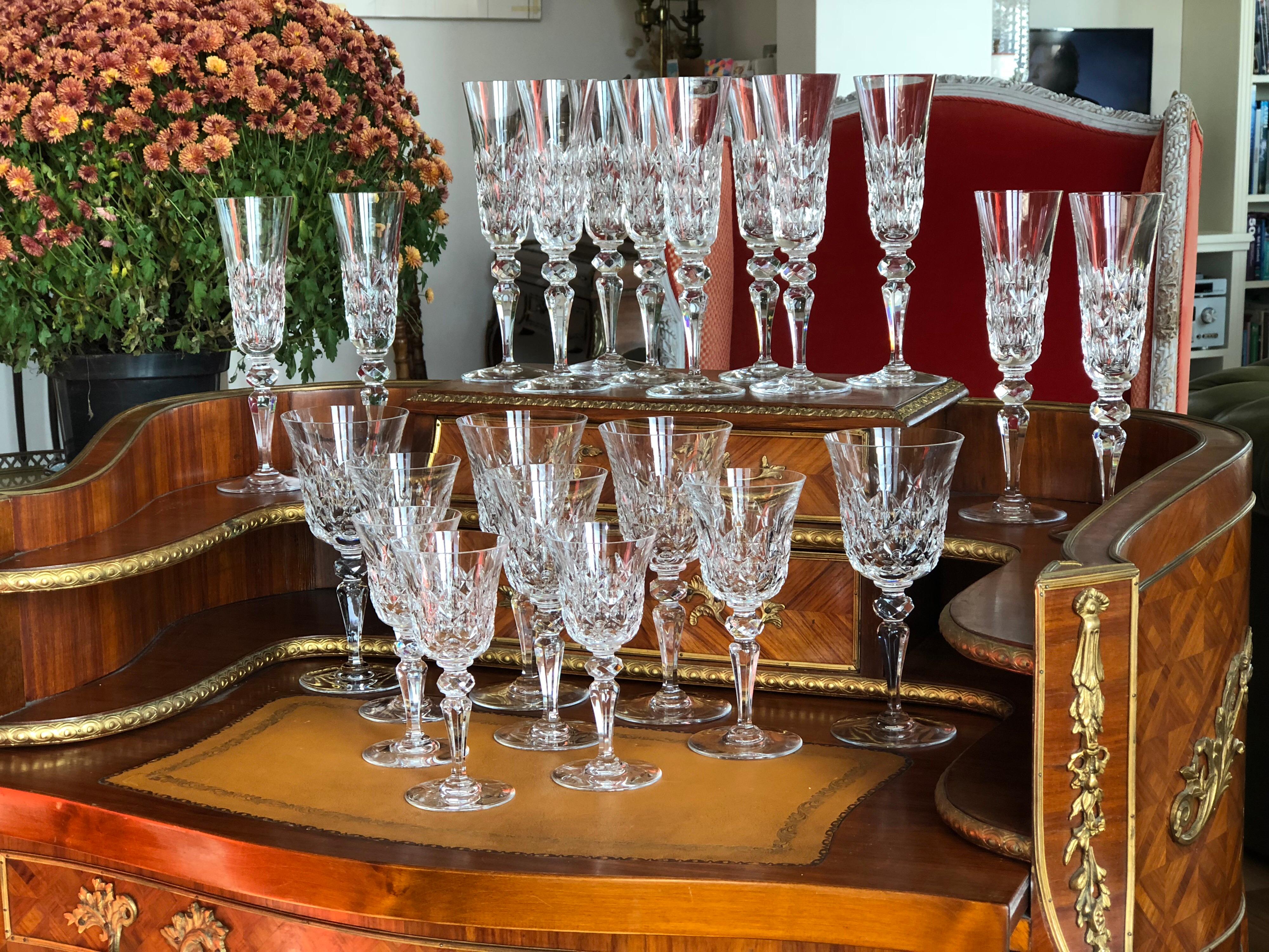 A rare and exceptional vintage 36 pieces crystal service by Baccarat. 
The service comprising: eight champagne glasses; eight white wine glasses; eight red wine glasses; eight liqueur glasses.
France, circa 1930.