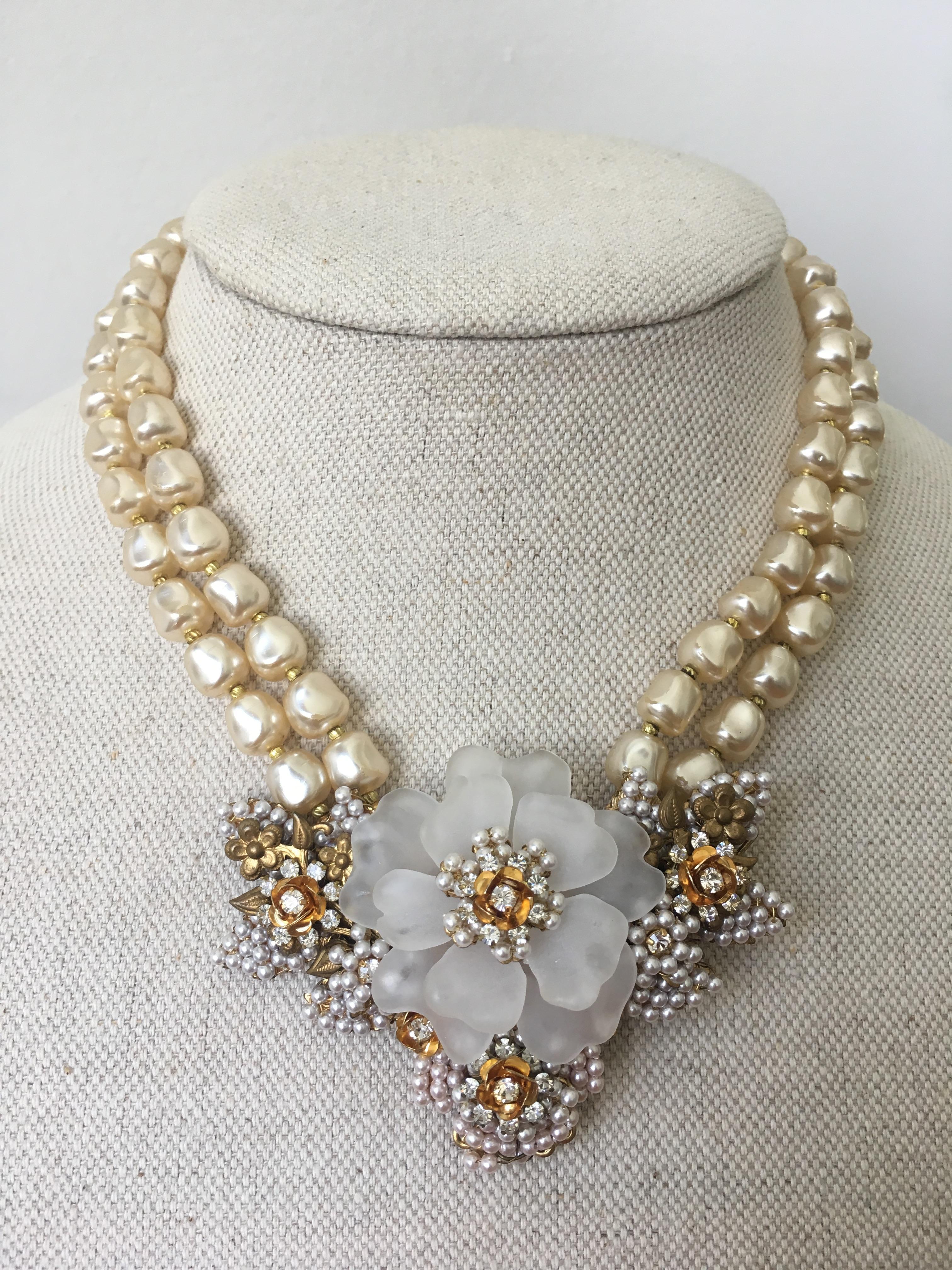 This stunning Camellia, pearl and crystal necklace has the characteristic features of Stanley Hagler's work but no oval stamp is present.

Similar to the work of Stanley Hagler jewelry this piece is wired by hand, with stones and crystals prong-set