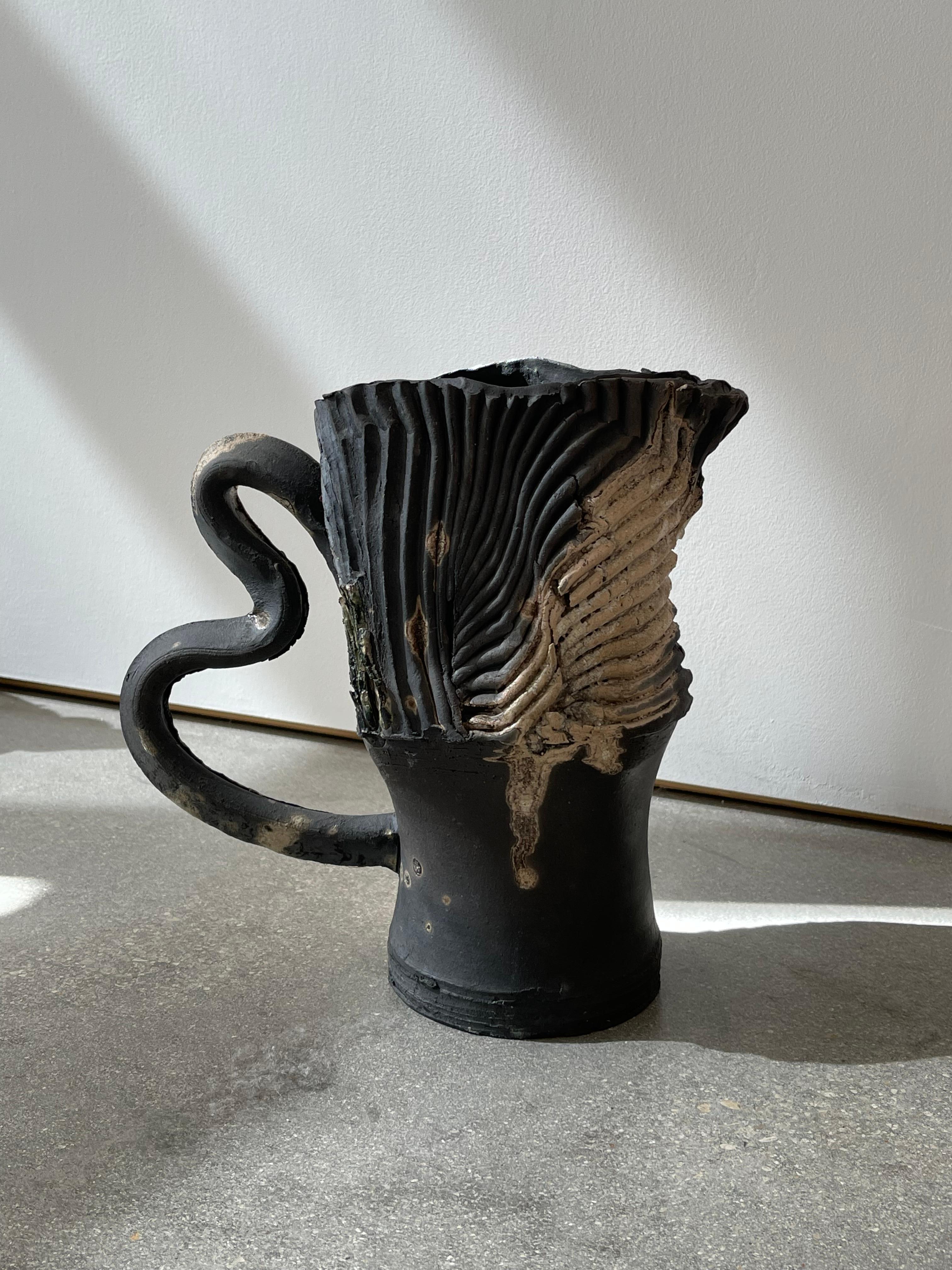 20th century vintage ceramic handled vessel handmade with Varela engraved in the bottom. Unique grooved design with texture and hand painted technique. Amazing brutalist style piece that can be placed beautifully in your home. 

Dimensions:
11