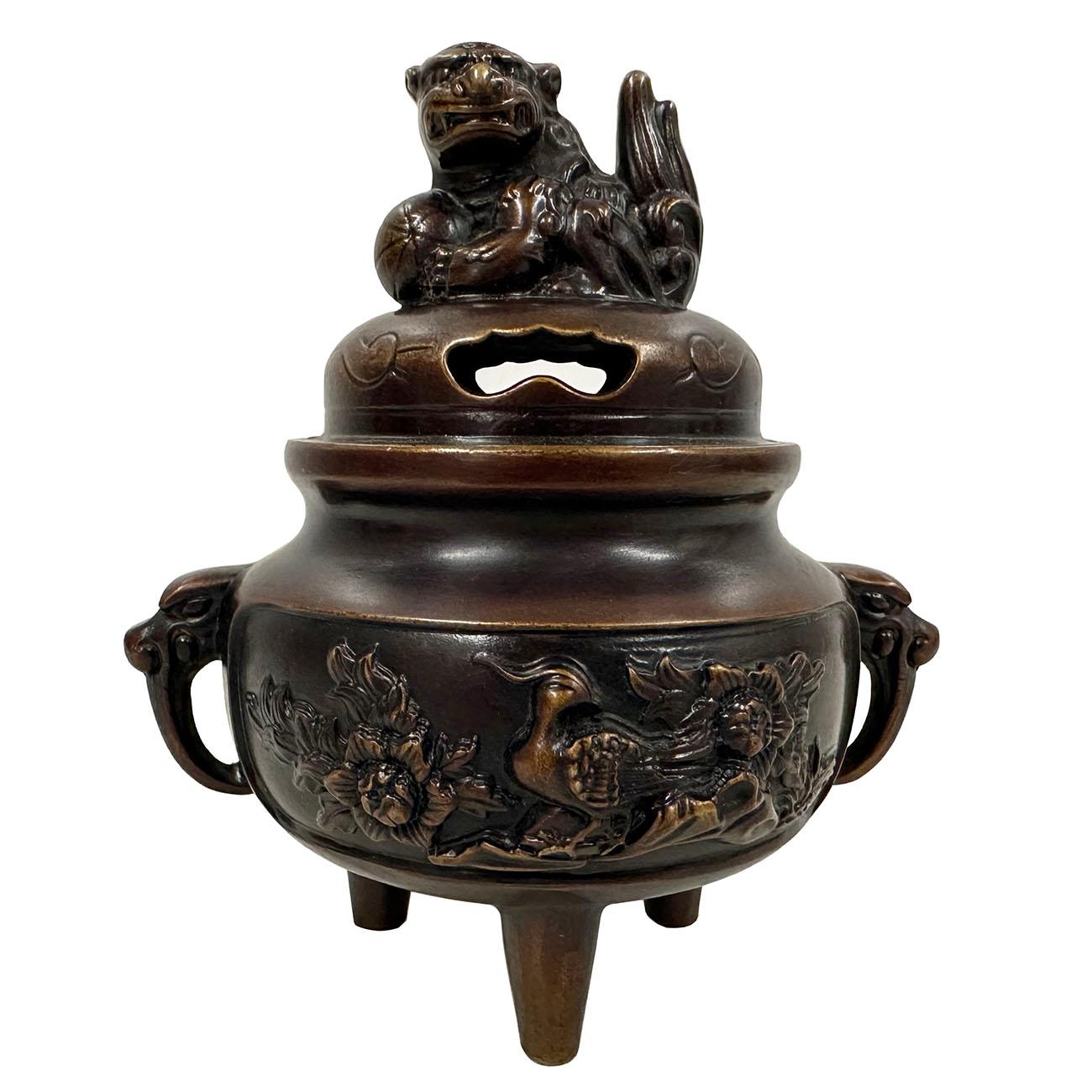 This magnificent Chinese Antique Carved Bronze incense burner has very detailed hand craft works around the body, elephants trunk as legs and handle and lotus bud on the lid of incense burner. It has very detailed art works around it. Open carved