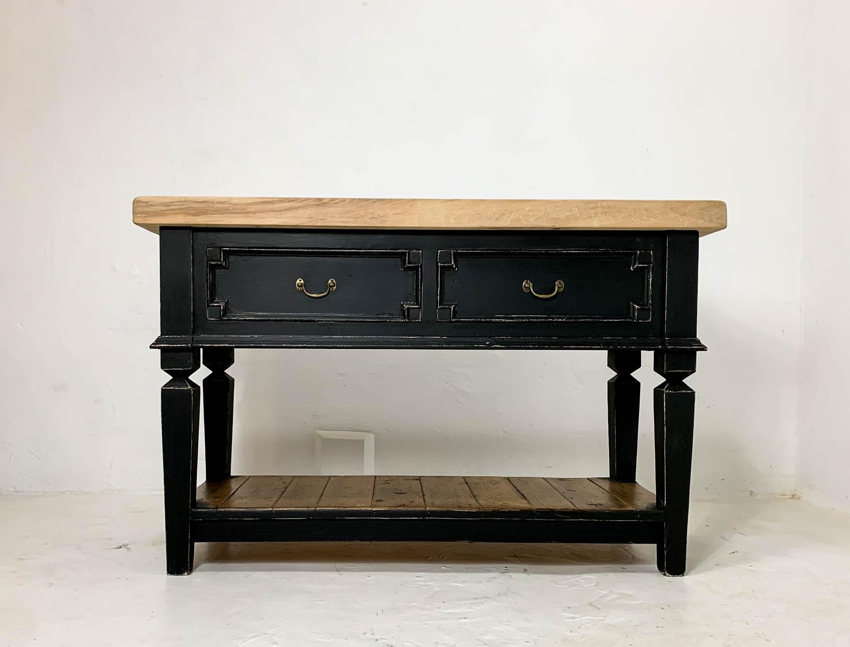 Early 20th century pine Butcher's block base which has been fully restored. It is a double-sided unit with two drawers on either side; making it the perfect piece for use as a small kitchen island. The later black paint has been sanded back to